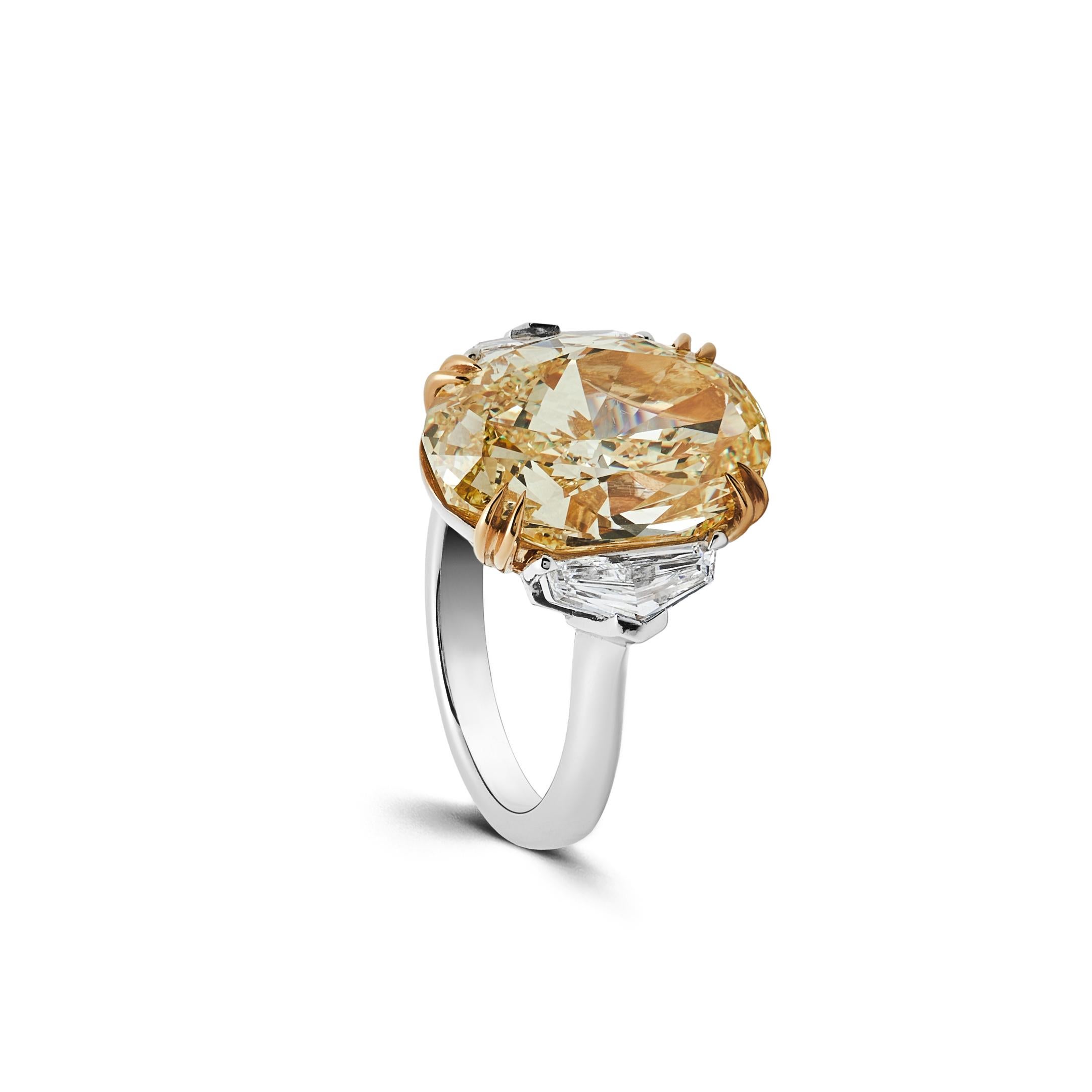 Modern GIA Certified Intense Yellow Oval Diamond Ring II For Sale