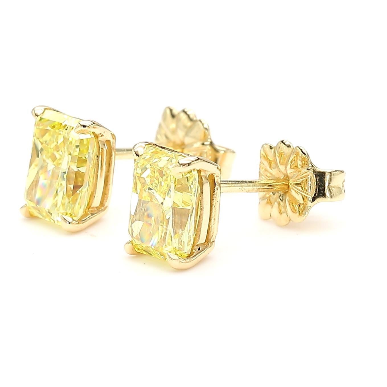 RareGemWorld's beautiful GIA certified diamond earrings. Mounted in a beautiful 18K Yellow Gold setting with natural radiant cut yellow diamonds. These earrings are guaranteed to impress and enhance your personal collection!

Total Weight: