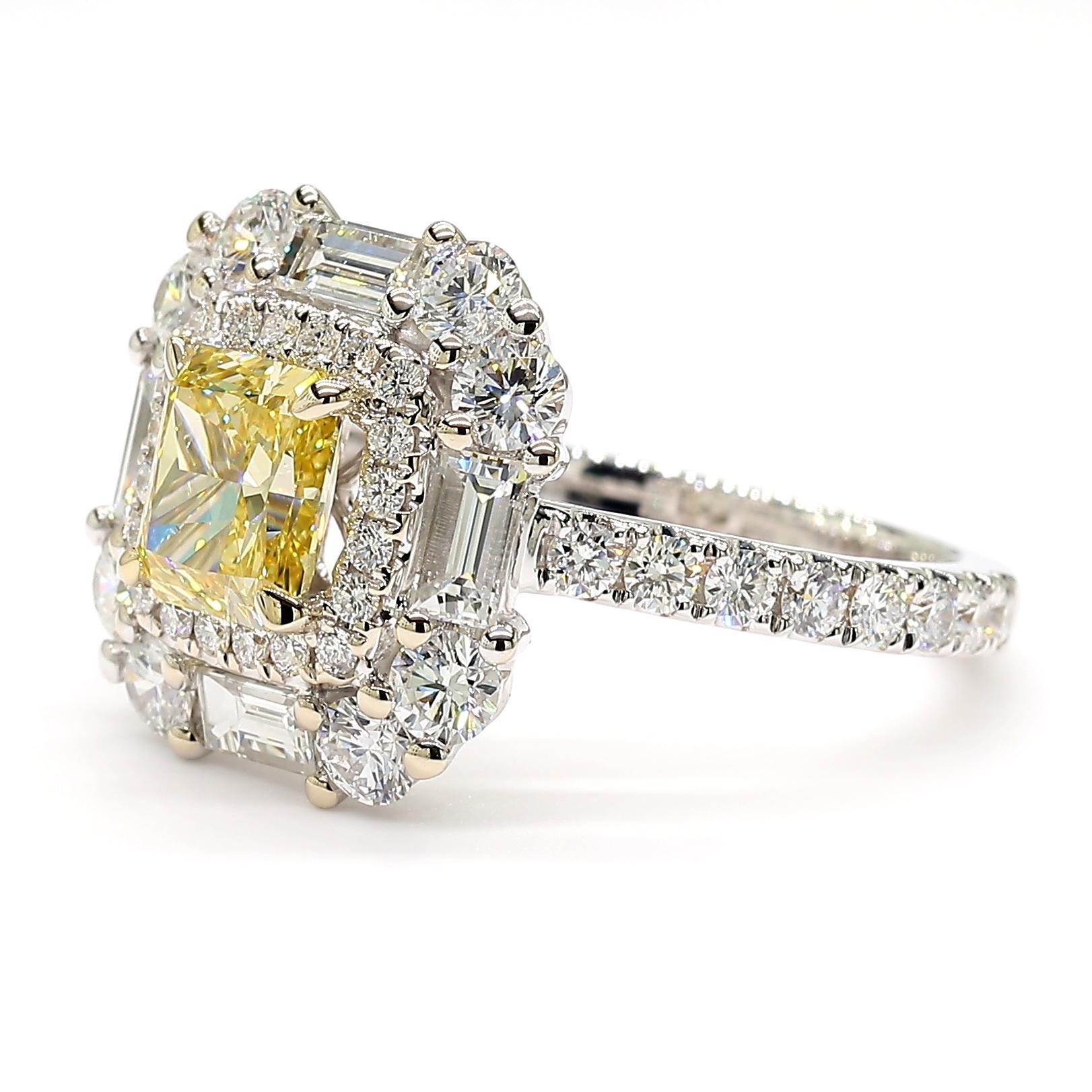 RareGemWorld's beautiful diamond ring. Mounted in a beautiful 18K Yellow and White Gold setting with a natural radiant cut yellow diamond. The yellow diamond is surrounded by two natural baguette cut white diamonds and round natural white diamond
