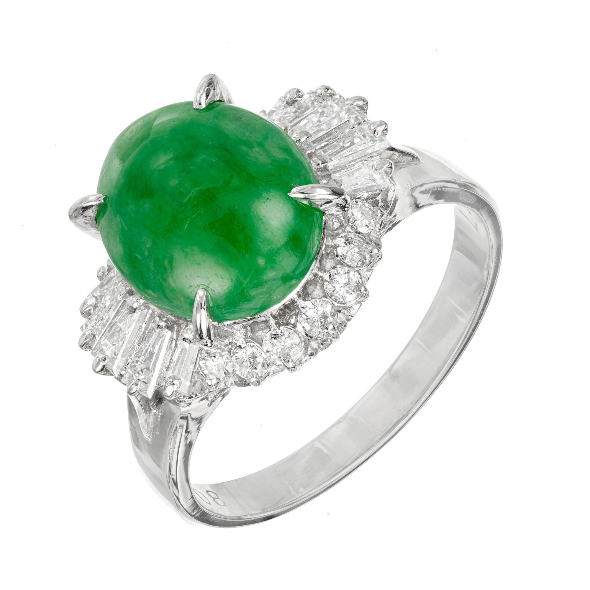 Jadeite Jade and diamond ring. GIA certified oval cabochon natural Jade center stone, in a platinum ballerina setting with a halo of round and baguette diamonds. The jade is certified natural, no indications of impregnations. 

1 oval jadeite jade