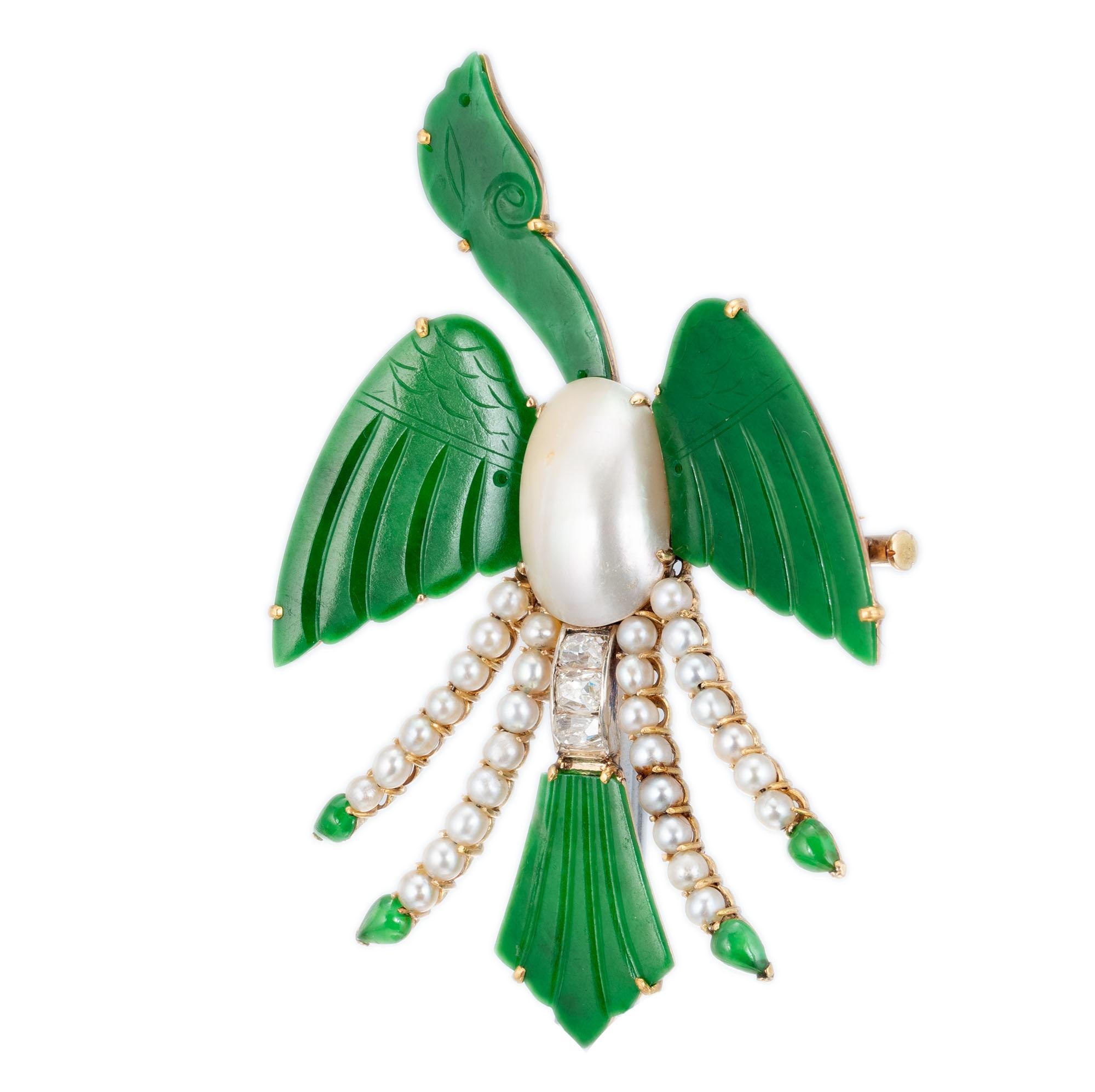 Natural untreated jadeite jade bird brooch with diamond and pearl accents. Handmade in 18k yellow gold 

4 pierced carved green jade GIA Certificate # 5202642859
4 pear cabochon green jade 
1 oval mabe Ivory hue pearl
30 round gray crème pearls