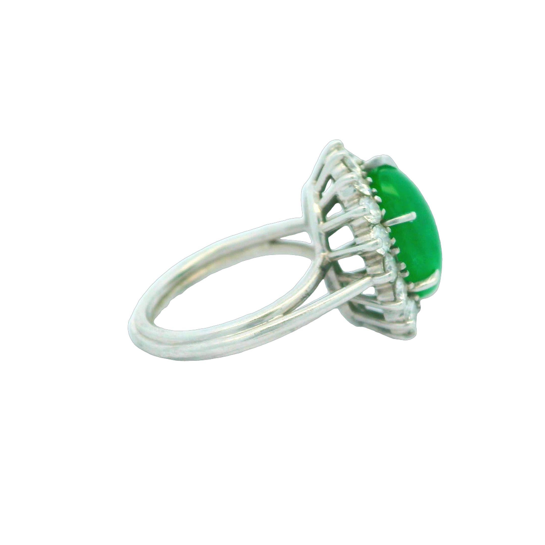 Alex & Co is offering this fine natural jadeite jade and diamond cocktail ring. Crafted in platinum this prong set GIA certified center stone is a highly desirable Type A (no treatment) natural green color jadeite jade. The oval cabochon gemstone