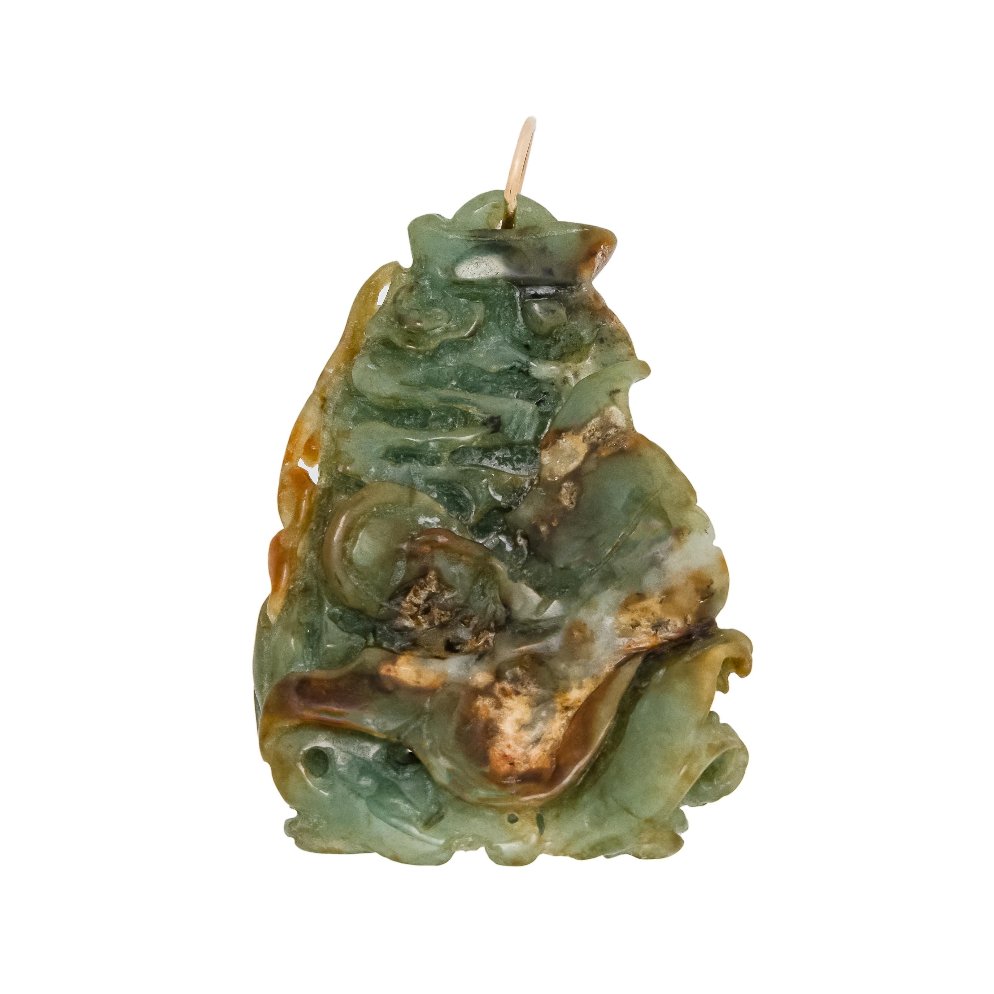 Mid-Century, 1950's Jadeite Jade carved fish pendant. Beautifully carved and high detailed variegated green brown and white translucent, jade that is certified by the GIA as natural with no indications of impregnation. 14k gold pendant loop.

1