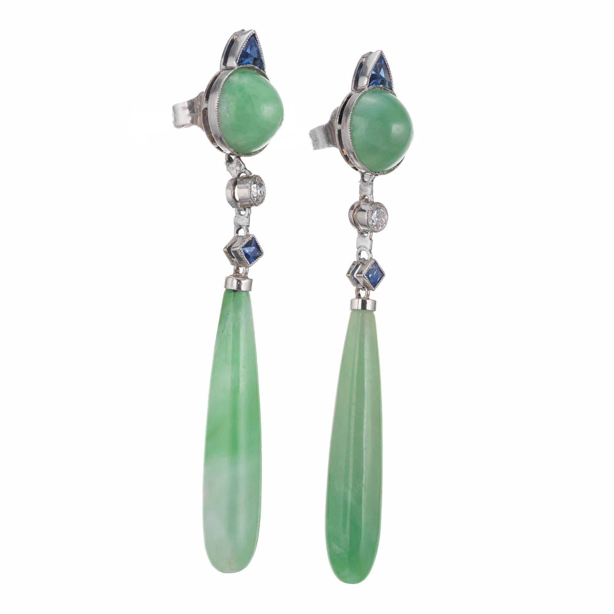 1920's Art Deco Jadiete Jade, diamond and sapphire dangle earrings. GIA Certified untreated jade with diamond and sapphire accents. Platinum. 

2 round cabochon mottled green jadeite jade 7.3mm GIA Certificate # 2205587567
2 cylinder drops mottled