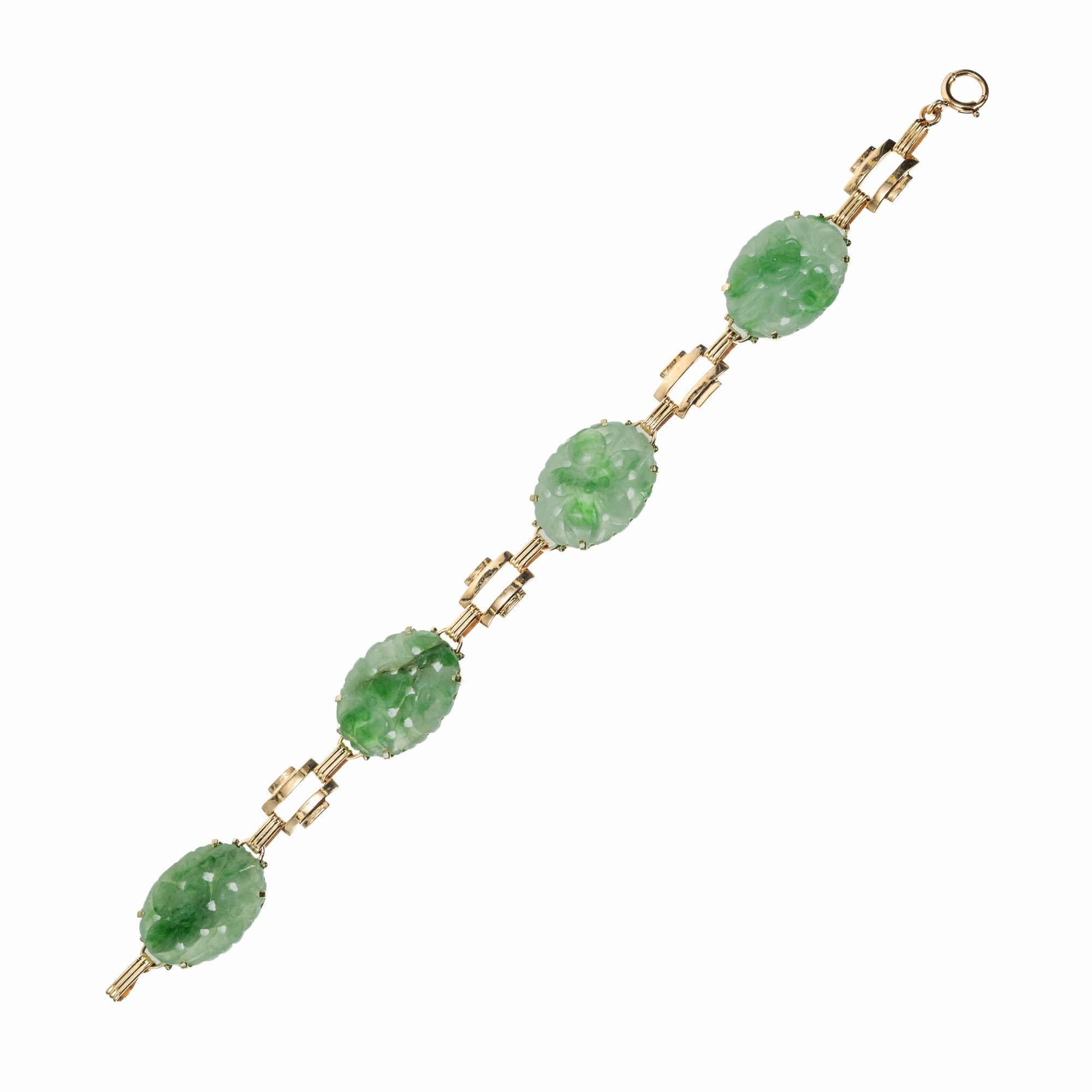 1940's Original Art Deco Retro jadeite jade bracelet. GIA certified 4 oval carved variegated flower design jade 14k yellow gold bracelet. circa 1940's. Certified natural, untreated jade.  7 inches in length. 

Natural untreated Jadeite Jade oval