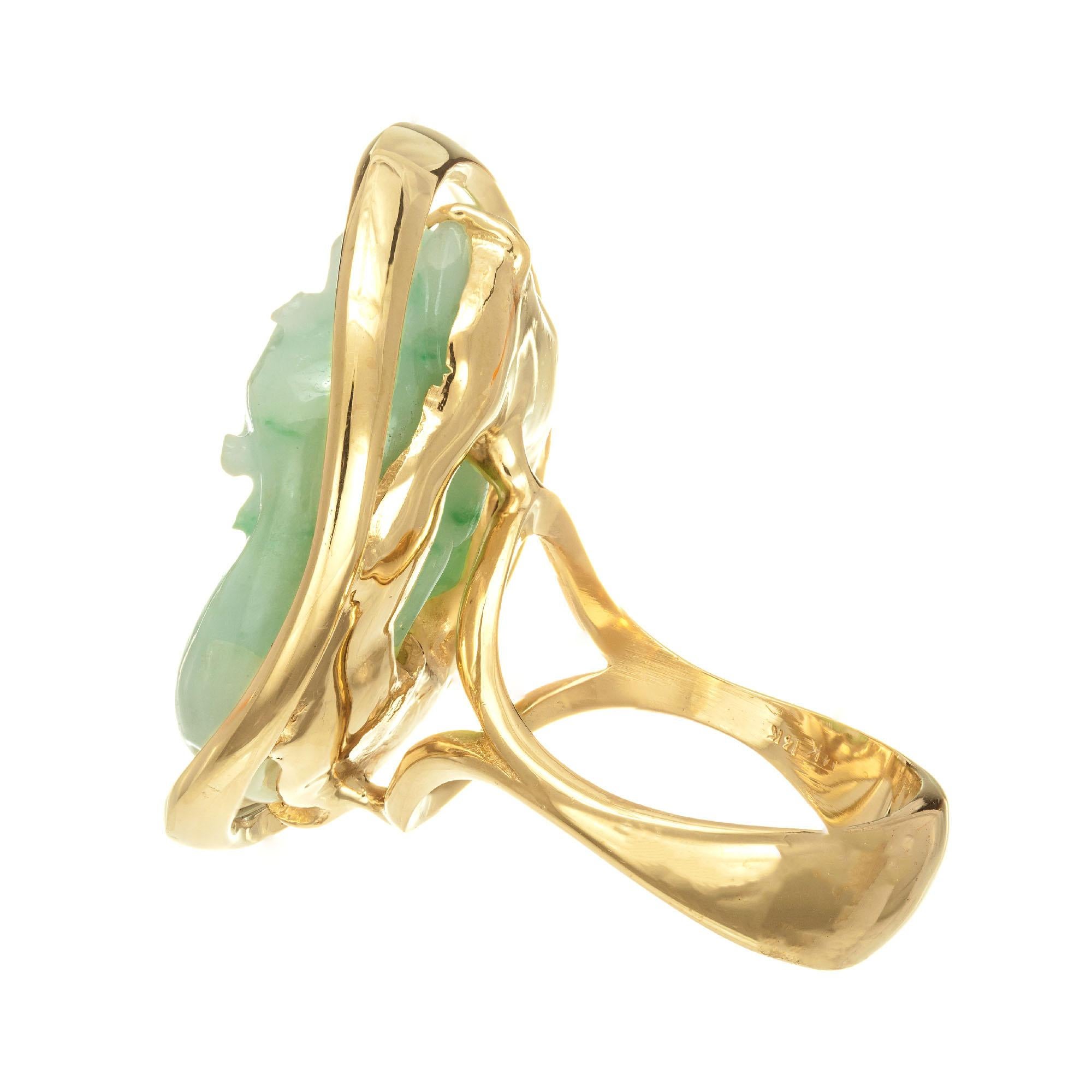 Natural untreated carved double cat Jadeite Jade cocktail ring. GIA certified. 14k yellow gold. 

1 pierced carving mottled green jadeite jade GIA Certificate # 5201517947
Size 11.75 and sizable
14k yellow gold 
Stamped: 14k
27.5 grams


