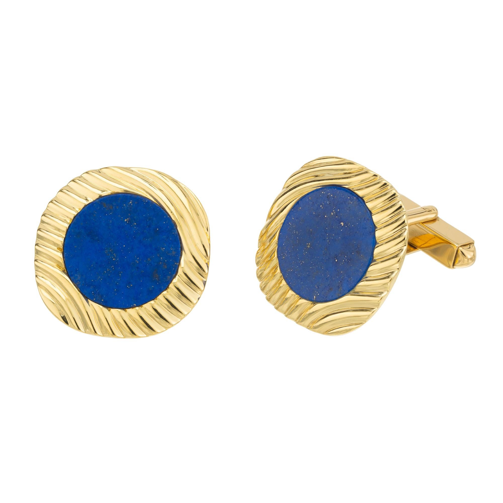 GIA Certified lapis lazulli men's cufflinks. 2 round lapis tablets set in 18k yellow gold men's cufflinks. Unknown designer. Certified by the GIA. The deep blue hue of the lapis lazuli stones, known for their celestial charm, beautifully contrasts