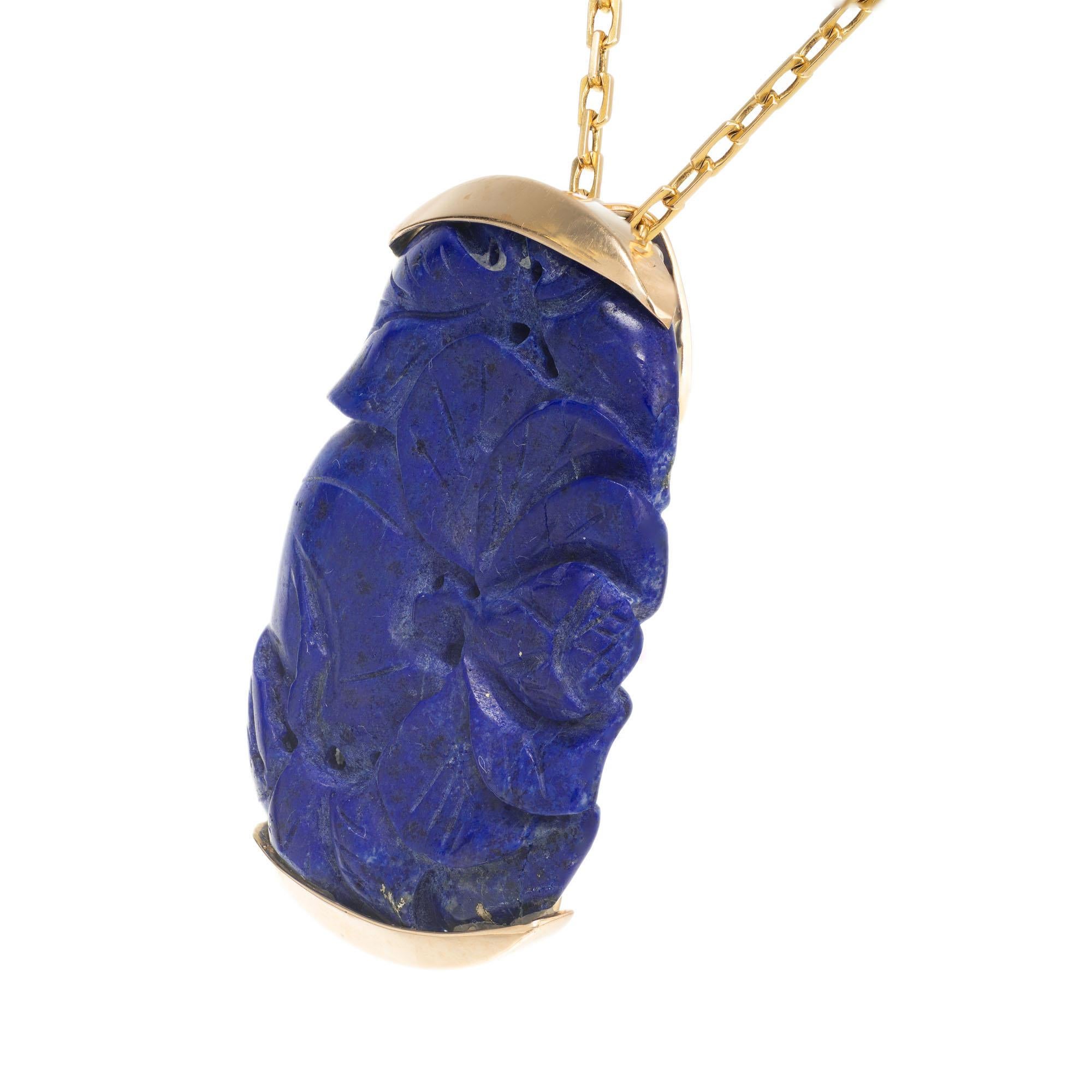 Natural untreated carved lapis pendant in a handmade 14k yellow gold pendant necklace. 16 inch 14k yellow gold chain. 

1 pierced carved blue lapis GIA Certificate # 1182072083
14k yellow gold 
Stamped: not
Chain: 14k yellow gold 16 inch
14.9