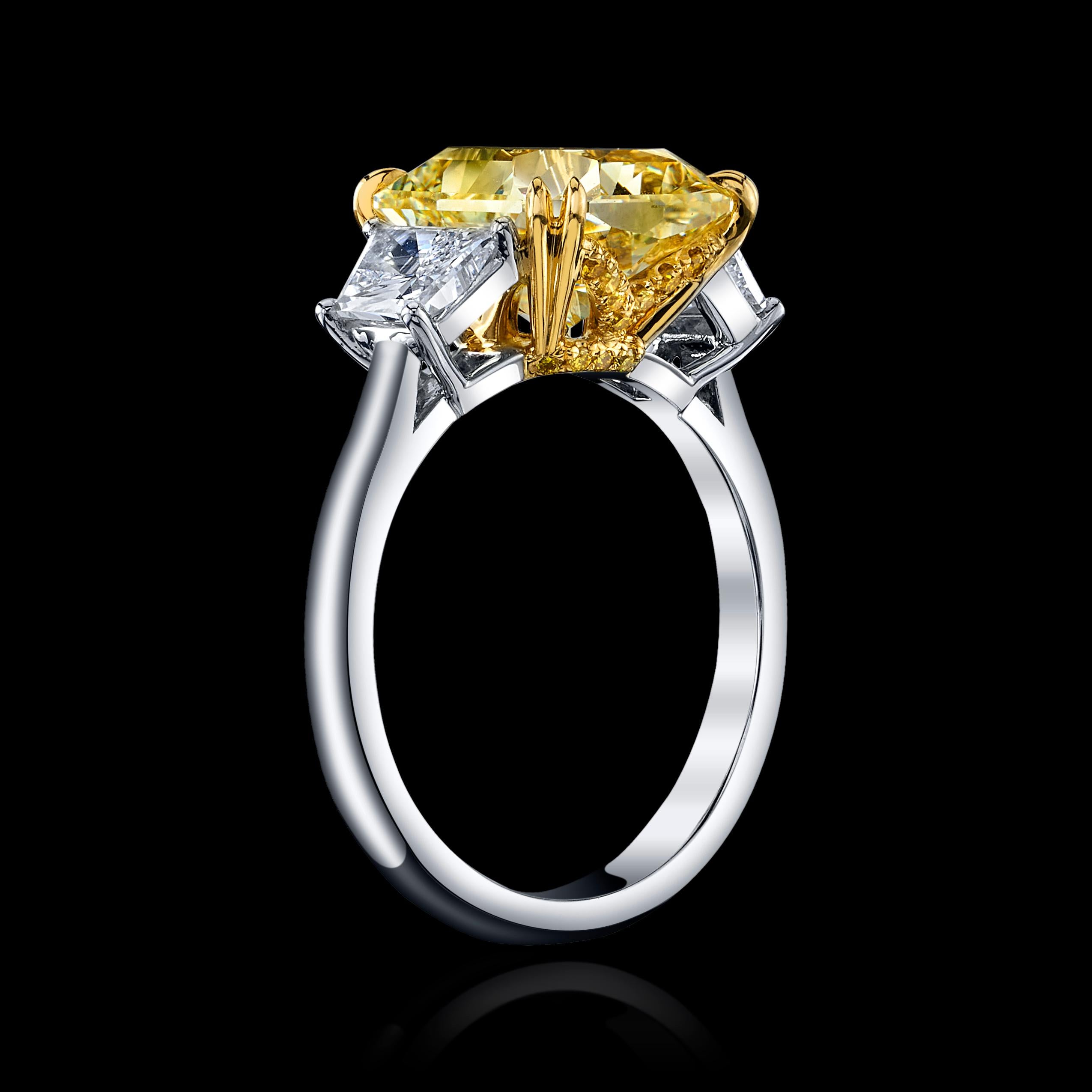 LARGE AND CLASSIC RADIANT 5.10CT FANCY YELLOW DIAMOND, IF

5.10ct RAD FY, IF, 

GIA #5212807103 

set in Platinum + 0.42 Trapezoids D color, VVS1 clarity, GIA# 5386705926 

and + 0.39ct Trapezoid D color, VS1 clarity GIA #2386298305 

PLUS 0.11cttw