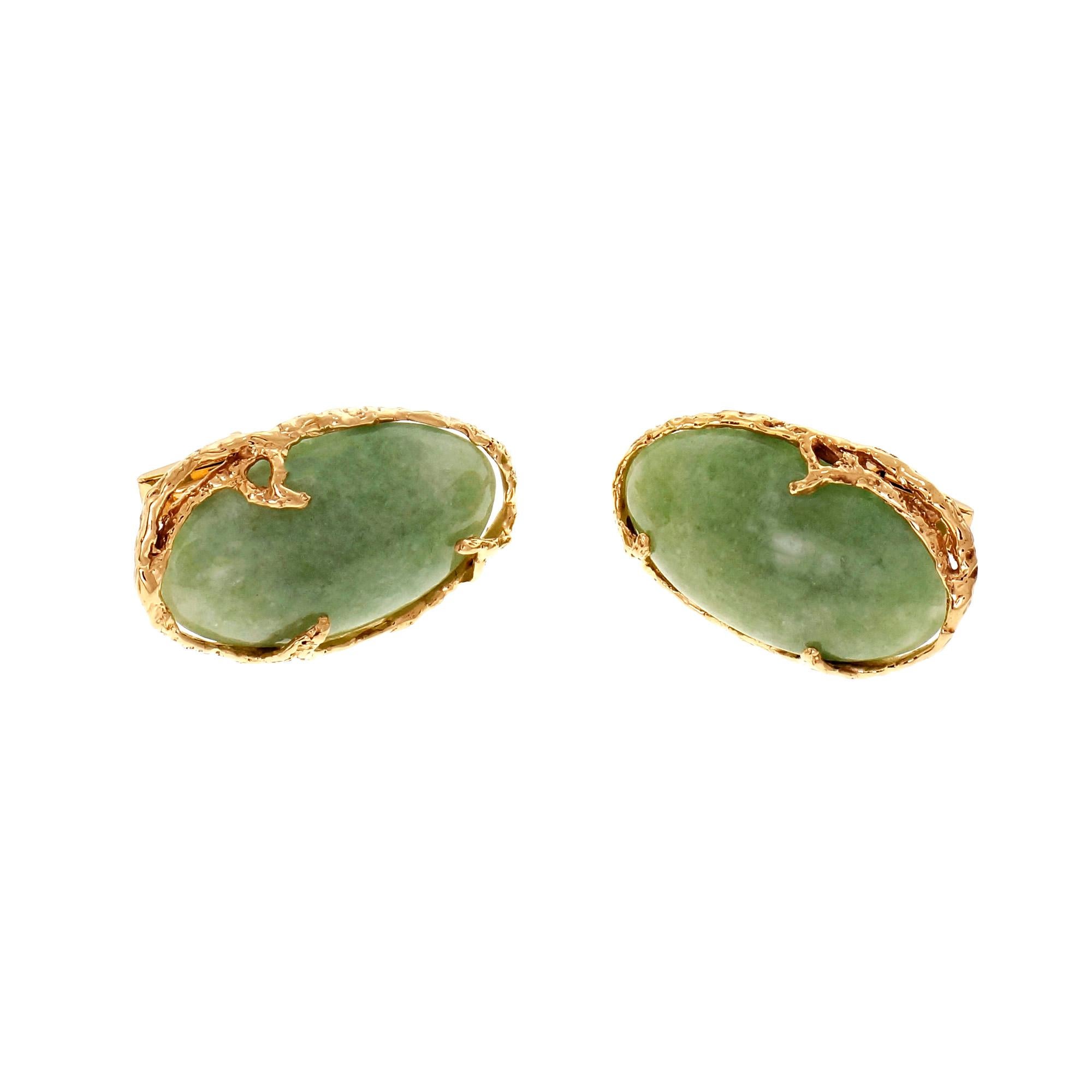Large oval Jade cufflinks circa 1960, GIA certified Jadeite dyed to improve the color. Referred to as “B” grade.

2 oval green Jadeite Cabochon, 30.95 x 17.9 x 6.4mm, GIA certificate #5192463736
14k yellow gold
Tested and stamped: 14k
13.5 grams
Top