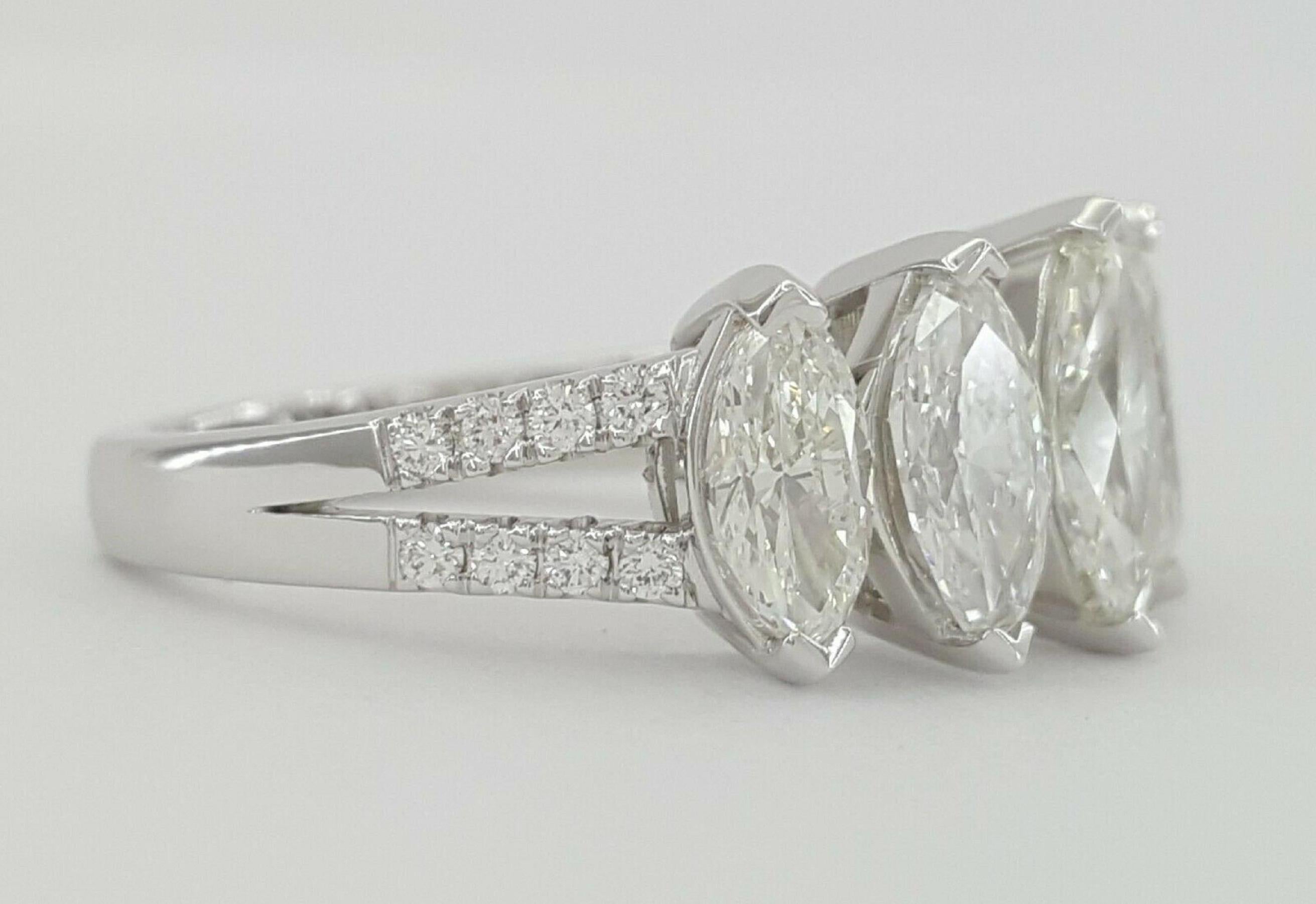 This stunning band ring features a beautiful 2.30 carat marquise diamond, certified by the esteemed Gemological Institute of America (GIA). Set in a sophisticated 18K white gold band, this ring combines elegance with contemporary style, making it a