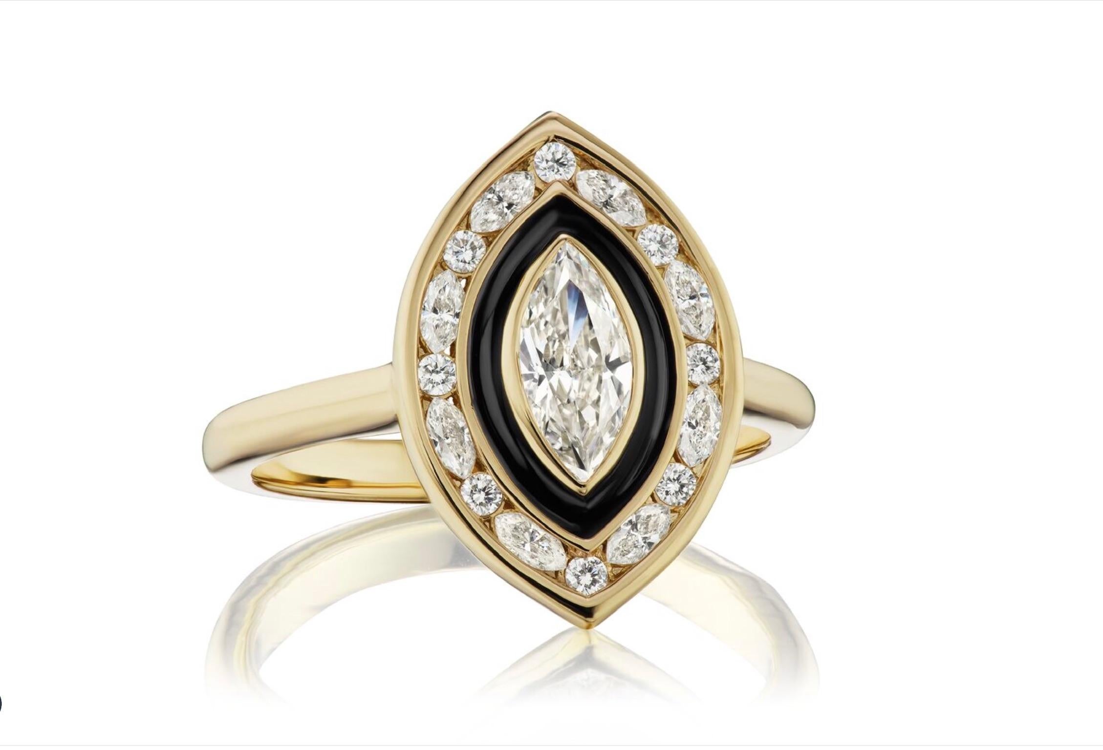 GIA certified .51 carat Marquise Diamond in H Color and SI 2 clarity. The ring is done in the Museum Style Series of Andrew Glassford and surrounded by a band of Black Enamel. On the outer channel is a row of 8 Marquise diamonds (GH Color SI 1) and