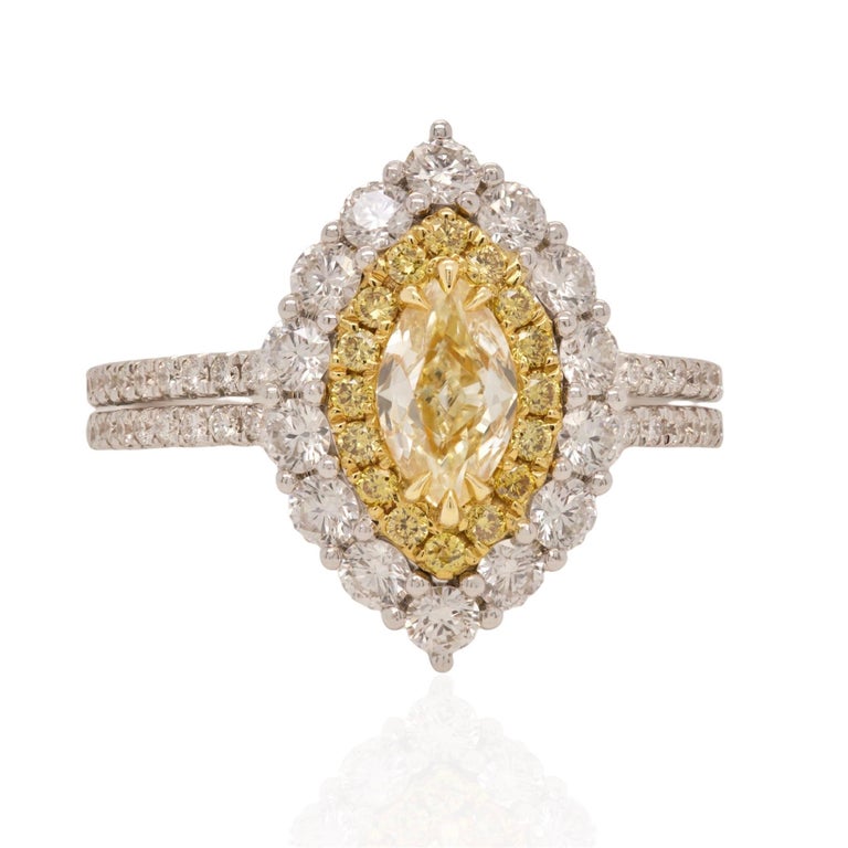Elegant Elongated Yellow Diamond Marquise Ring 
GIA Certified 0.50ct Natural Fancy Yellow VS1 Center

Total Diamond Weight: 1.84ct

Set in an expertly crafted 18K gold setting with diamonds beautifully set into the under gallery as well. 
Ring Size