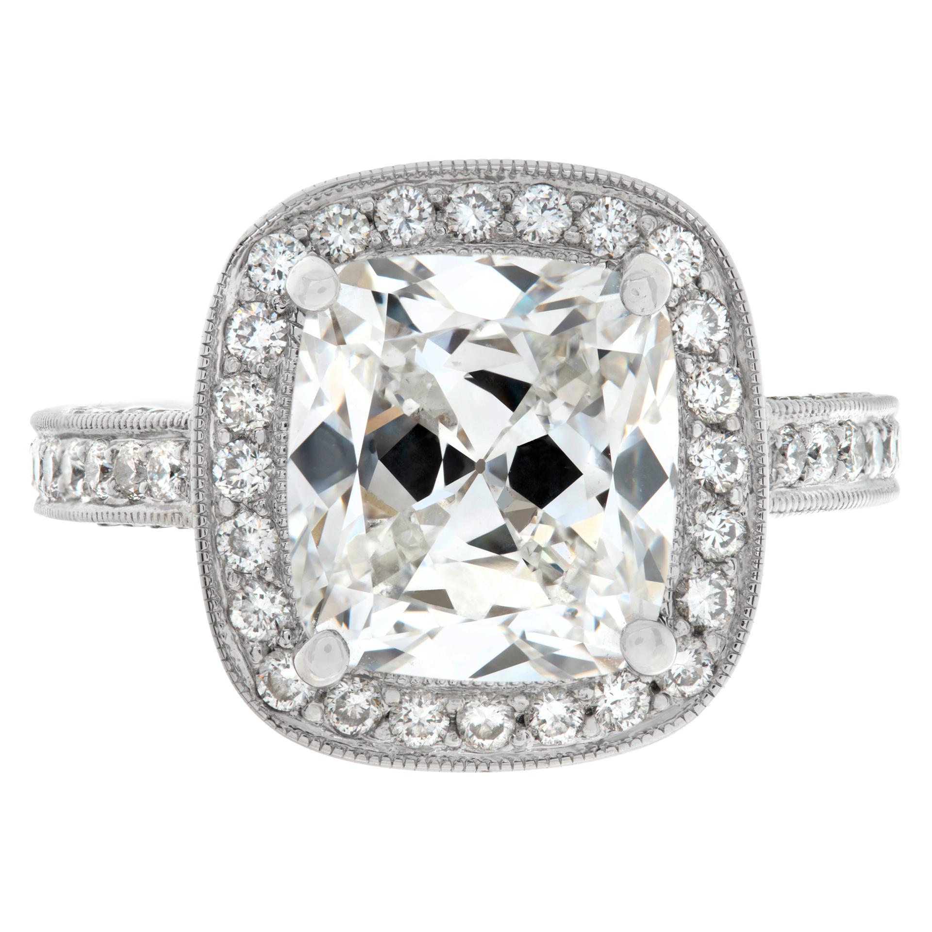 GIA certified cushion modified brilliant cut diamond 5.17 carat ( G color, SI2 clarity) ring mounted in 18k white gold diamonds setting. Round brilliant cut diamonds total approx. weight: 1.50 carat, estimate G color- VS/SI clarity. 5/8 x 5/8 inches