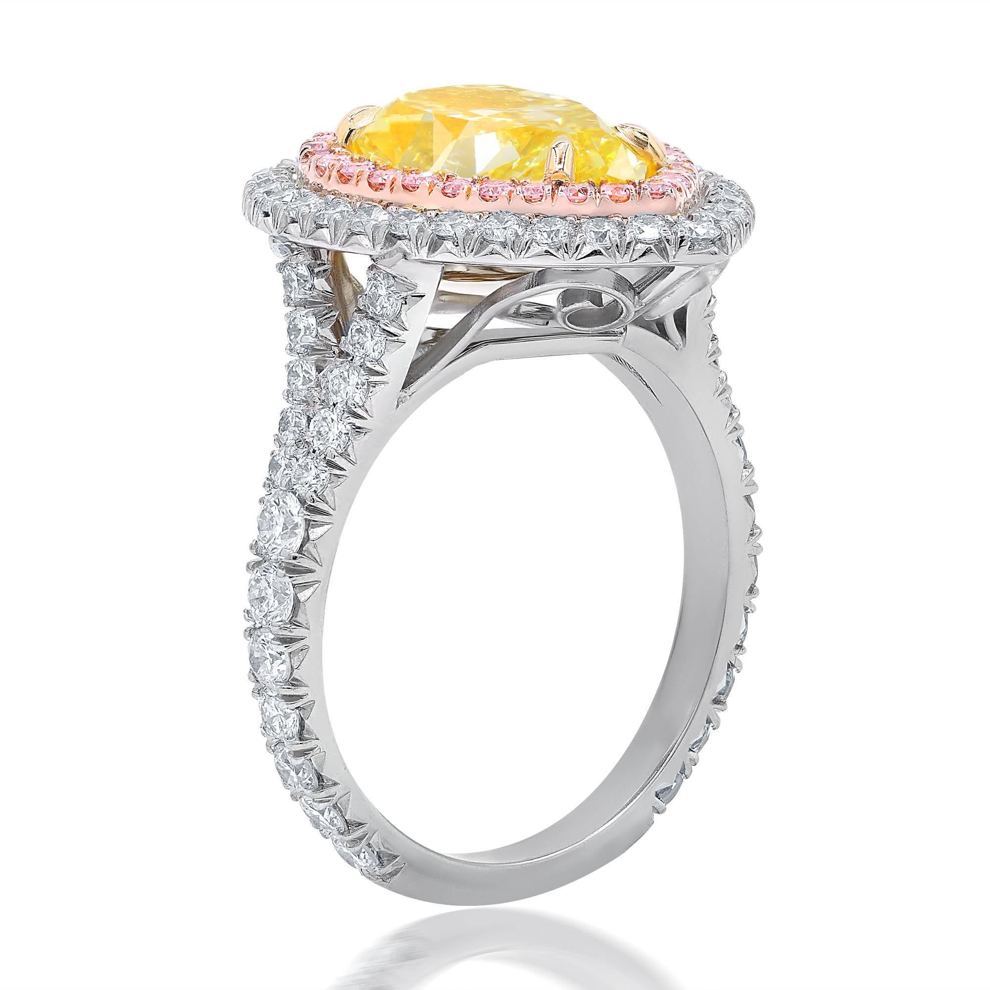 Custom designed diamond engagement ring with GIA certified natural fancy yellow pear brilliant  cut diamond in the center,weighing 3.50 carats VS2 clarity set in double halo mounting with 1.25 carats total of pink and white round brilliant cut
