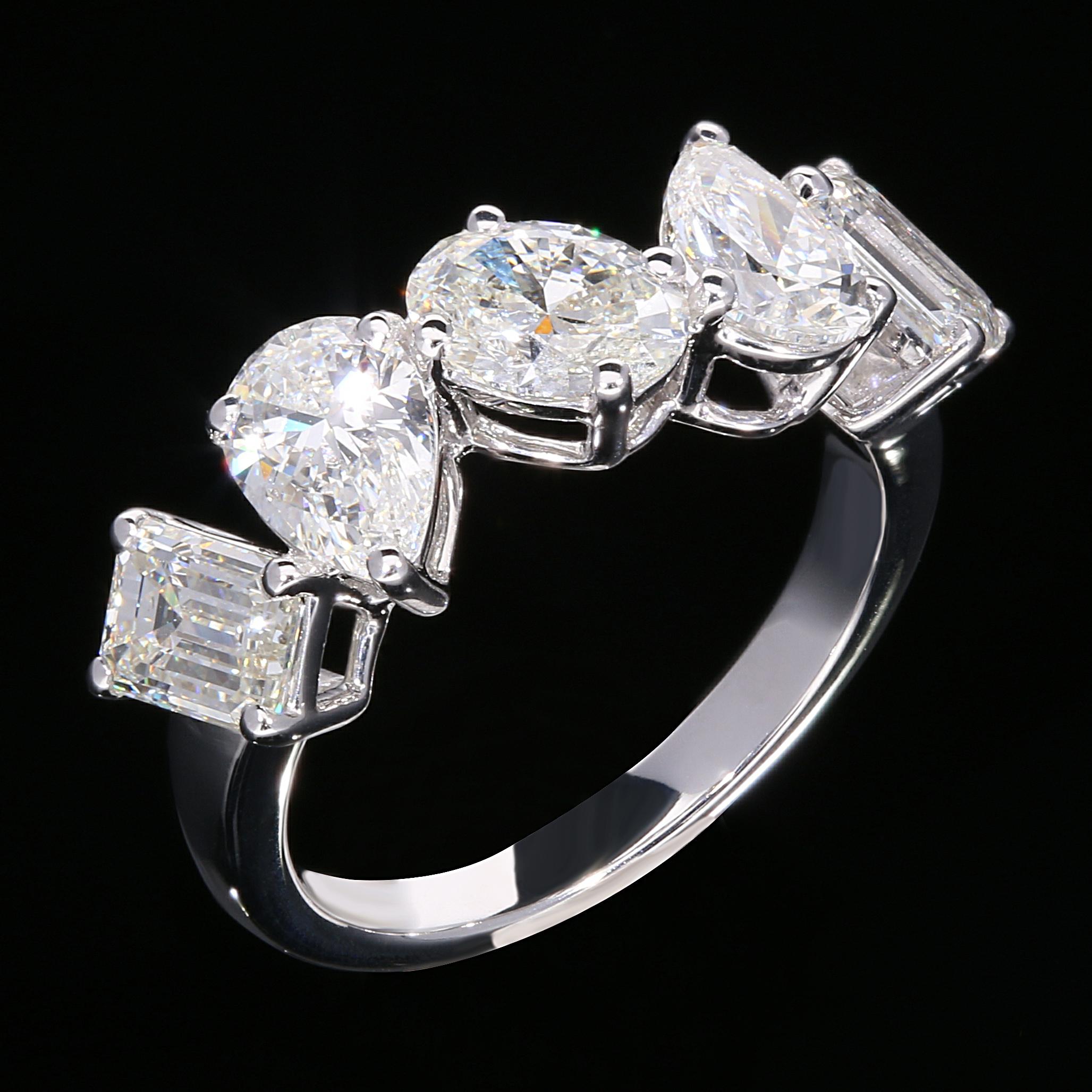 A Modern and Glamorous GIA Certified Multi Shape Diamond Cocktail Ring. Each Diamond Weighs 0.7 Carats and is H Color, with Ranging Clarities of Internally Flawless to VS1. The Stone Shapes are 2 Pear cut Diamonds (H VVS2 for both), 2 Emerald Cut