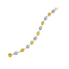 Bracelet en diamants jaunes et blancs de formes multiples certifiés par le GIA