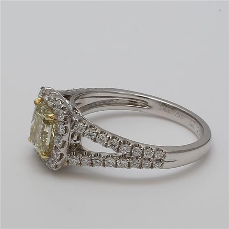 1.14cts GIA certified rare radiant natural yellow diamond surrounded with natural round white diamonds. This ring is designed to be in a simple setting. Can be used as an engagement ring or in addition to your collection of jewels. 

Total Weight: