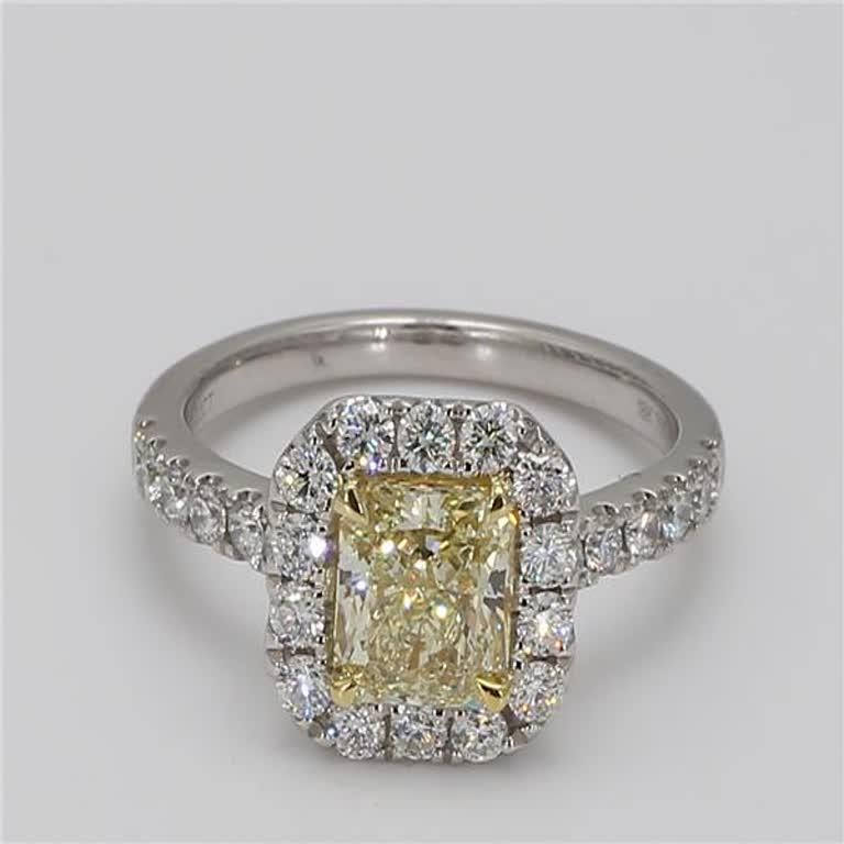 1.22cts GIA certified rare radiant natural yellow diamond surrounded with natural round white diamonds. This ring is designed to be in a simple setting. Can be used as an engagement ring or in addition to your collection of jewels. 

Total Weight:
