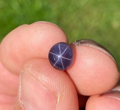 GIA Certified Natural 3.55 Ct., Dark Purple Star Spinel gemstone.