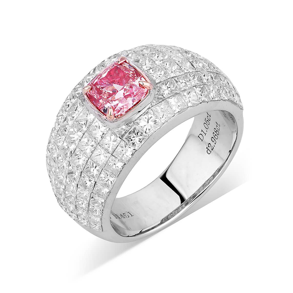 This piece consists of a natural untreated 1.05 fancy pink main diamond completely surrounded by smaller natural white diamonds, making up a total of 4.02 Carats. This piece has been expertly crafted using 18 Karat White Gold. Cushion Shape.