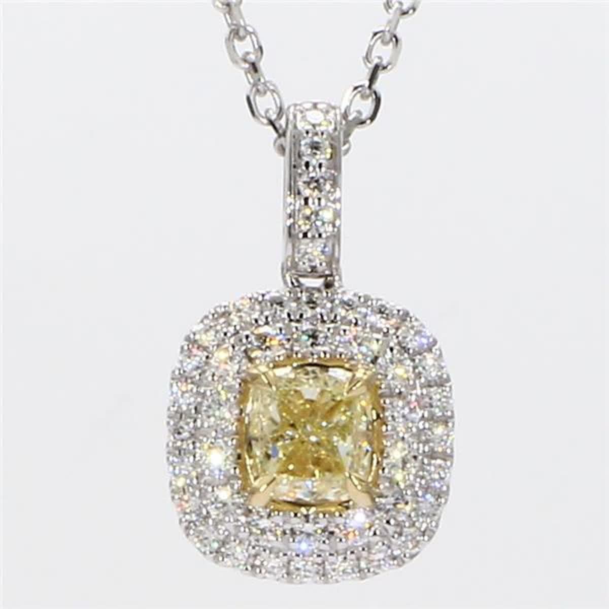 RareGemWorld's intriguing GIA certified diamond pendant. Mounted in a beautiful 18K Yellow and White Gold setting with a natural cushion cut yellow diamond. The yellow diamond is surrounded by small round natural white diamond melee. This pendant is
