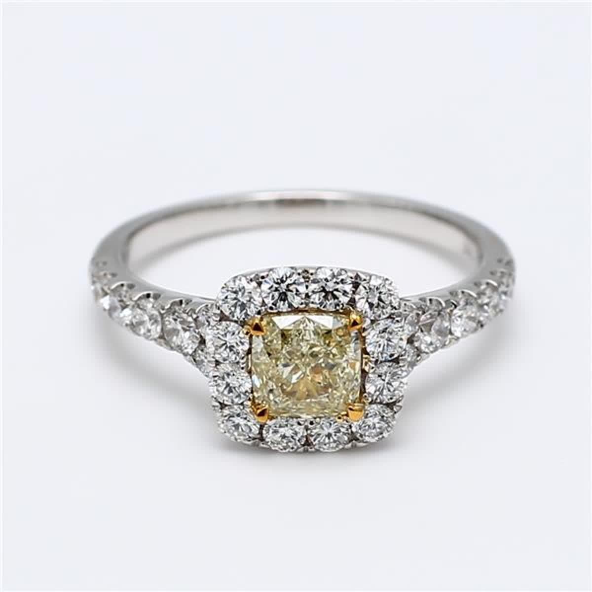 RareGemWorld's classic GIA certified diamond ring. Mounted in a beautiful 18K Yellow and White Gold setting with a natural cushion cut yellow diamond. The yellow diamond is surrounded by small round natural white diamond melee. This ring is