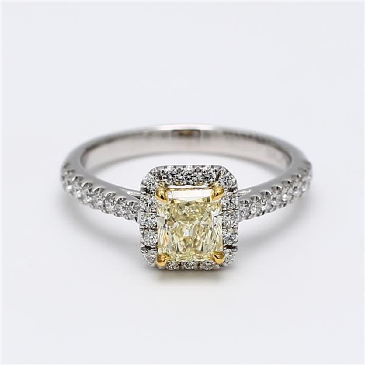 RareGemWorld's classic GIA certified diamond ring. Mounted in a beautiful 18K Yellow and White Gold and Platinum setting with a natural radiant cut yellow diamond. The yellow diamond is surrounded by small round natural white diamond melee. This