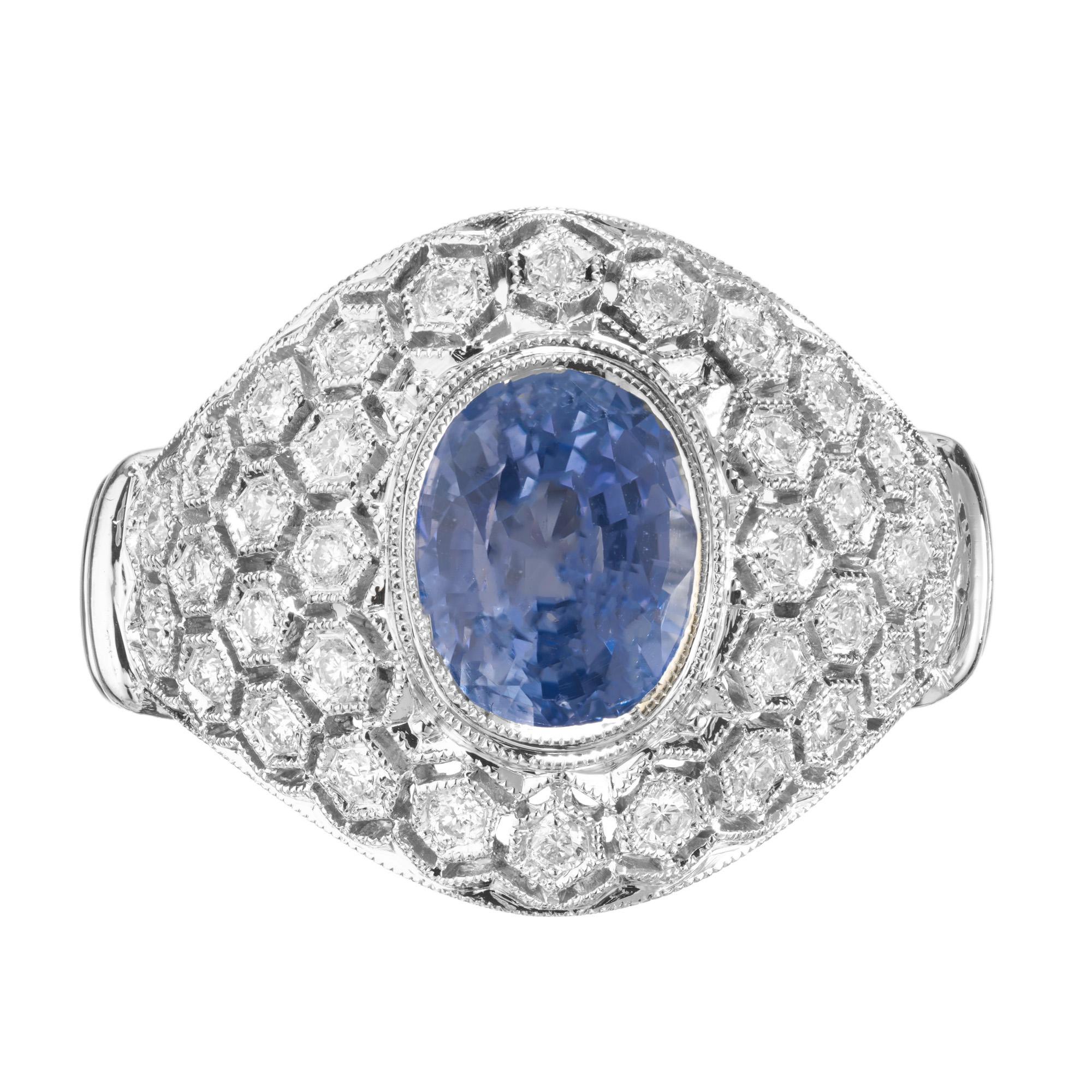Original 1930's Art Deco 18k white gold sapphire and diamond cluster cocktail ring. The center stone is a 2.18ct GIA certified oval periwinkle sapphire which is mounted in a handmade domed honey comb style setting, adorned with 34 full cut diamonds.