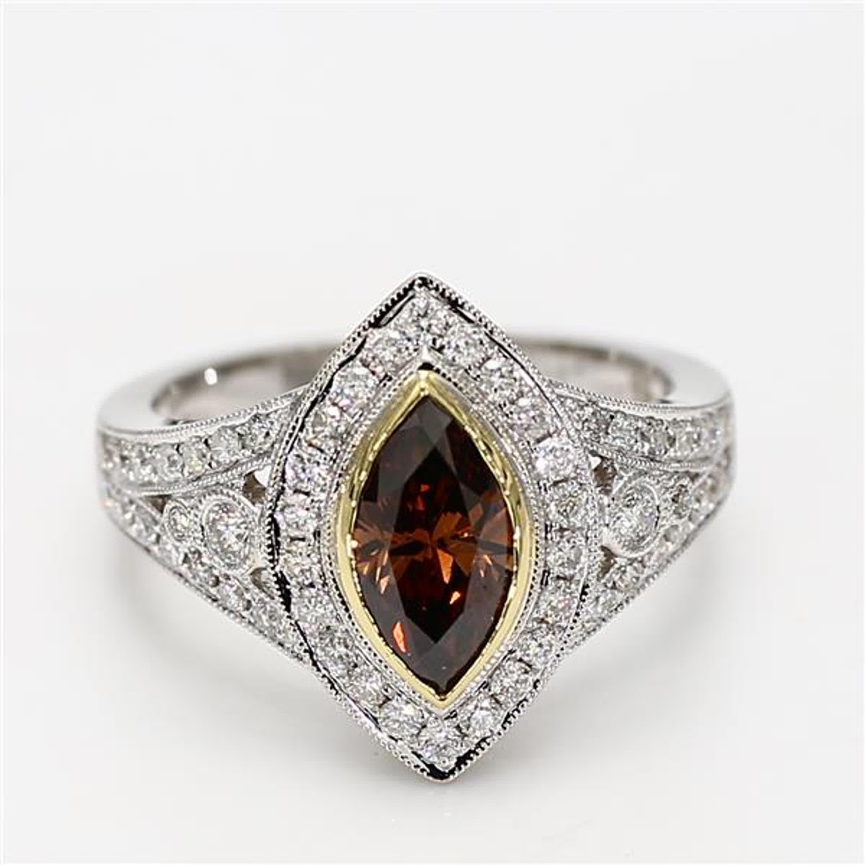 RareGemWorld's classic GIA certified diamond ring. Mounted in a beautiful 18K Yellow and White Gold setting with a natural marquise cut brown diamond. The brown diamond is surrounded by round natural white diamond melee. This ring is guaranteed to