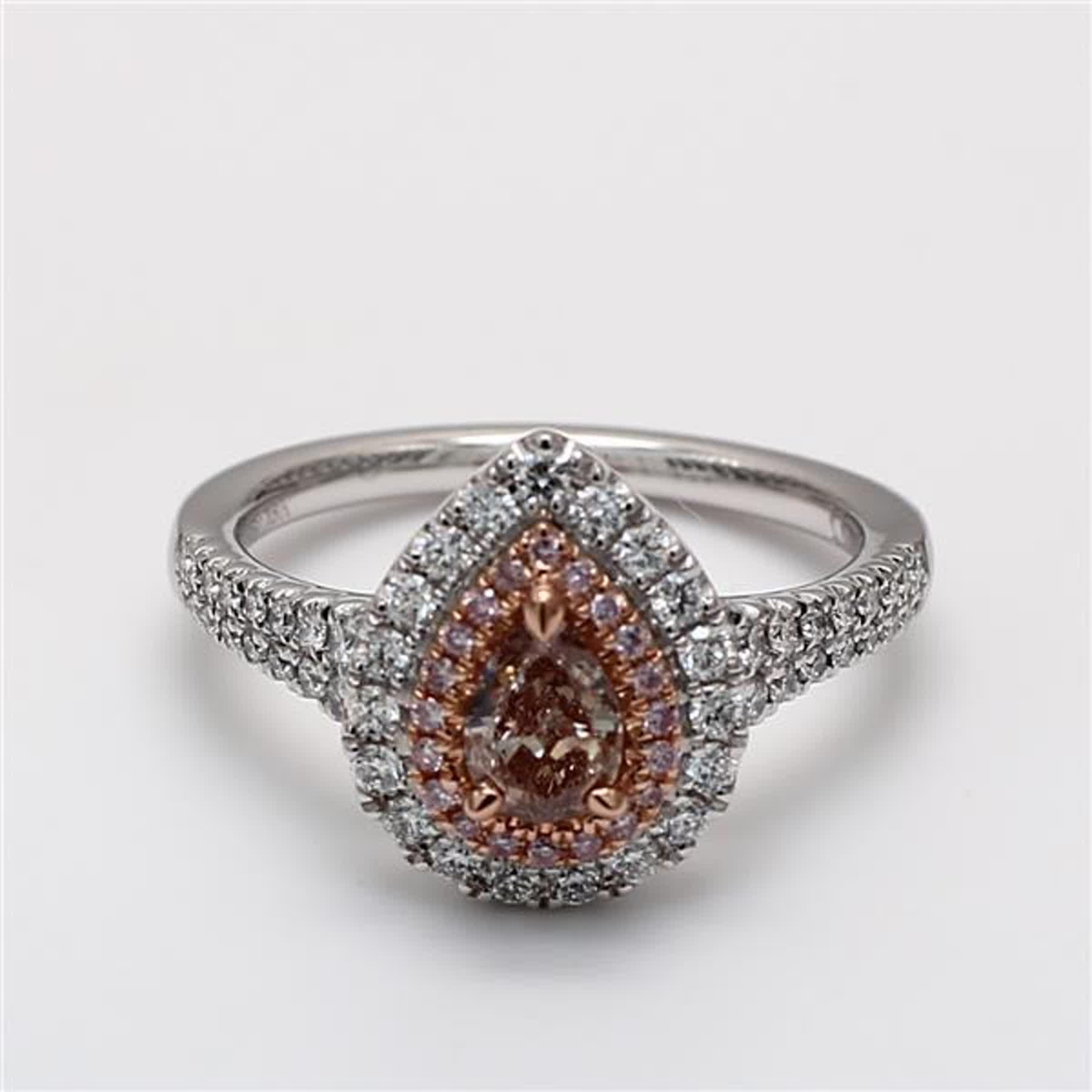 RareGemWorld's classic GIA certified diamond ring. Mounted in a beautiful 18K Rose and White Gold and Platinum setting with a natural pear cut brown diamond. The brown diamond is surrounded by round natural pink diamond melee and round natural white