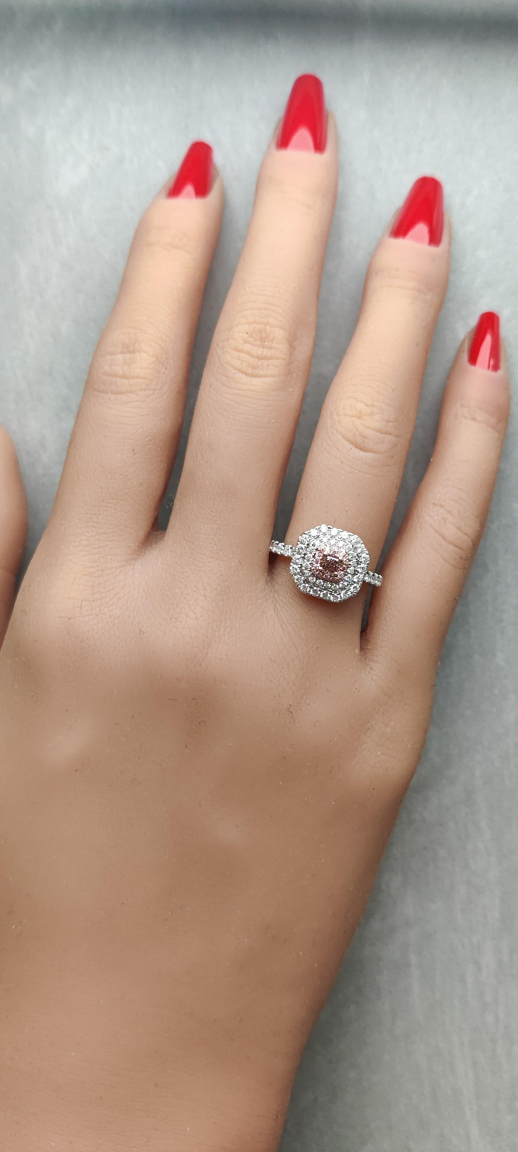 RareGemWorld's classic GIA certified diamond ring. Mounted in a beautiful 18K Rose and White Gold setting with a natural radiant cut brown diamond. The diamond has a pink look and is surrounded by round natural pink diamond melee and round natural