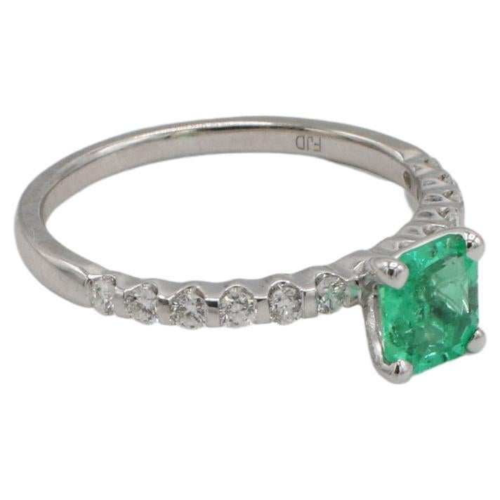 GIA Certified Natural Green Emerald & Diamond Solitaire Engagement Ring 
GIA report number: 5232517260
Emerald: 0.56 carat octagonal step cut natural Columbian emerald (see GIA report for details)
Metal: 14k white gold
Weight: 1.93 grams
Diamonds: