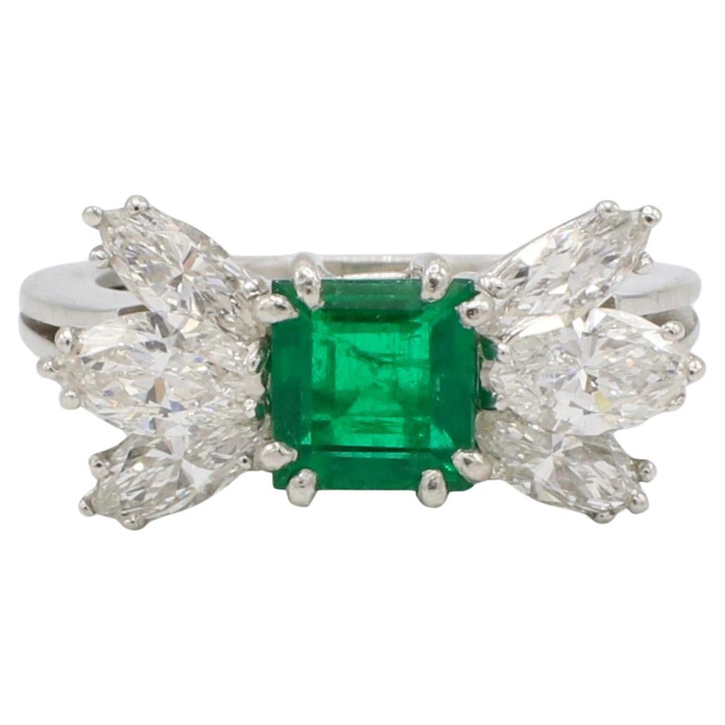 GIA Certified Natural Emerald & Diamond Platinum Cocktail Ring 
Metal: Platinum 7.25 grams
Emerald: 6.24 x 5.87 x 3.24mm approx. .75 carats. GIA certified natural emerald
Diamonds: 6 natural marquise diamonds, approx. 1.75 CTW F-G VVS
Height:
