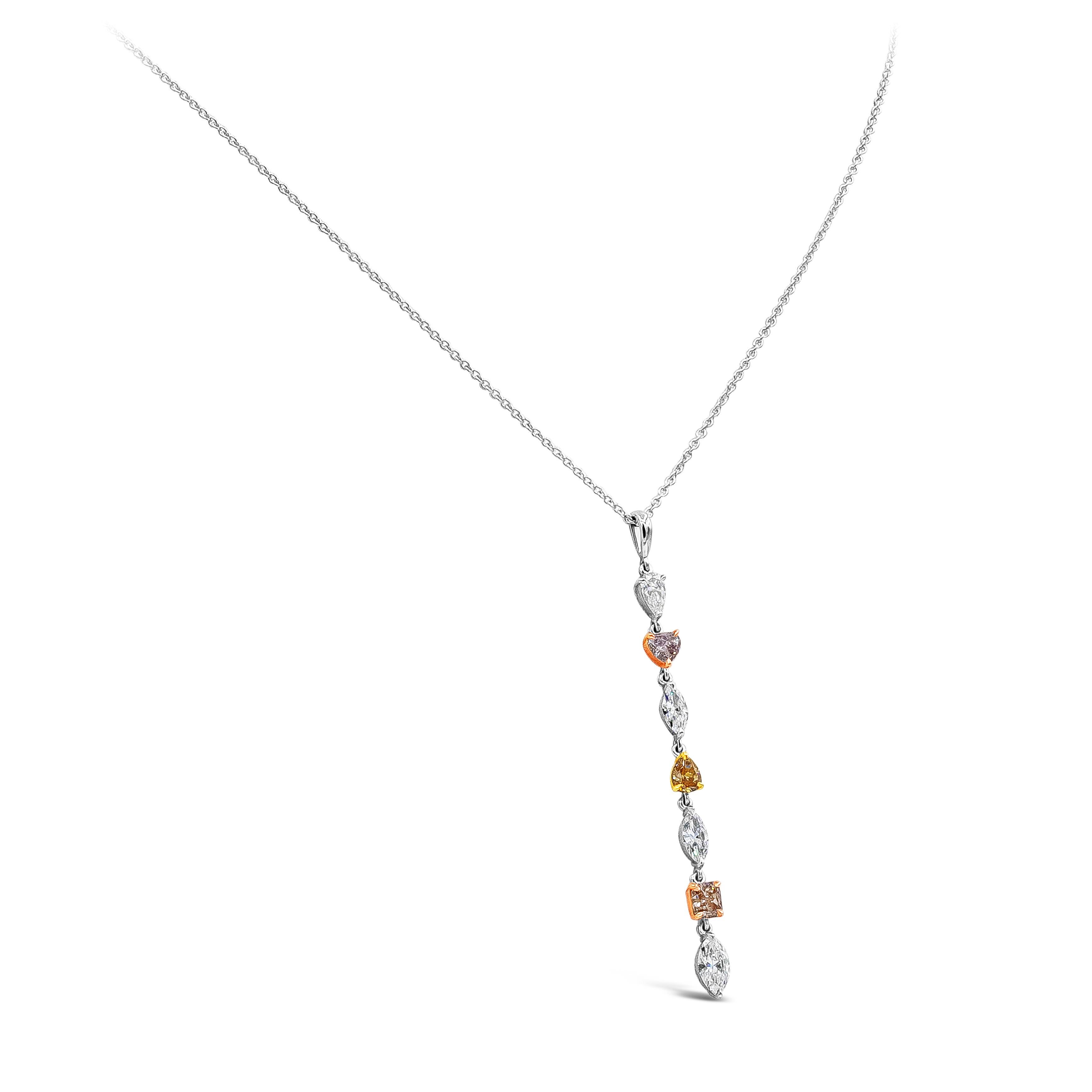 This is an incredibly gorgeous and colorful drop pendant necklace showcasing GIA certified fancy shaped diamonds set in an elegant drop design weighing 0.96 carats total. Spaced by marquise and pear shape white diamonds weighing 1.04 carats total, F