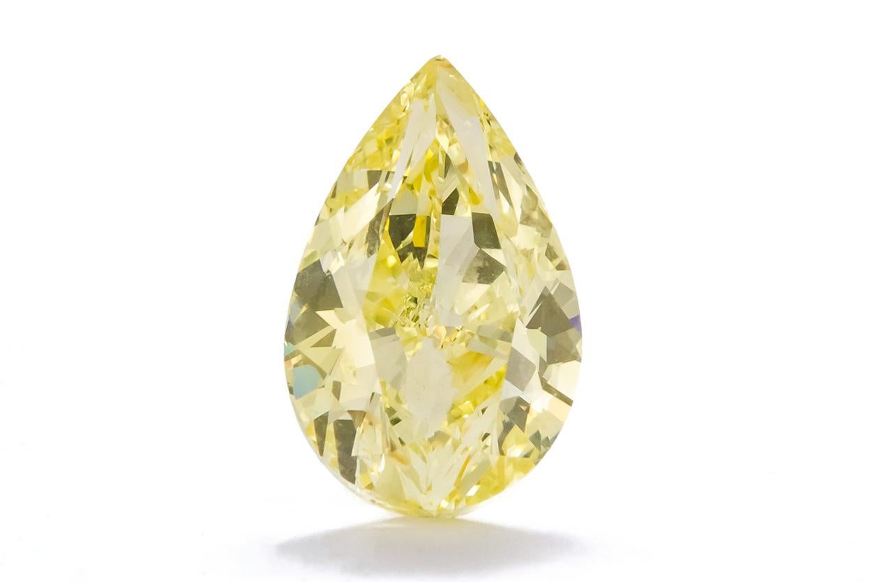 We are very pleased to present this stunning GIA Certified and Laser Inscribed Natural Fancy Yellow 5.01ct SI1 Pear Cut Diamond. This beautiful diamond measures in at 5.01ct and has been certified by GIA as SI1 natural fancy yellow. The diamond has