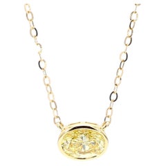 GIA Certified Natural Fancy Yellow Oval Diamond 0.74 Carat TW Gold Necklace