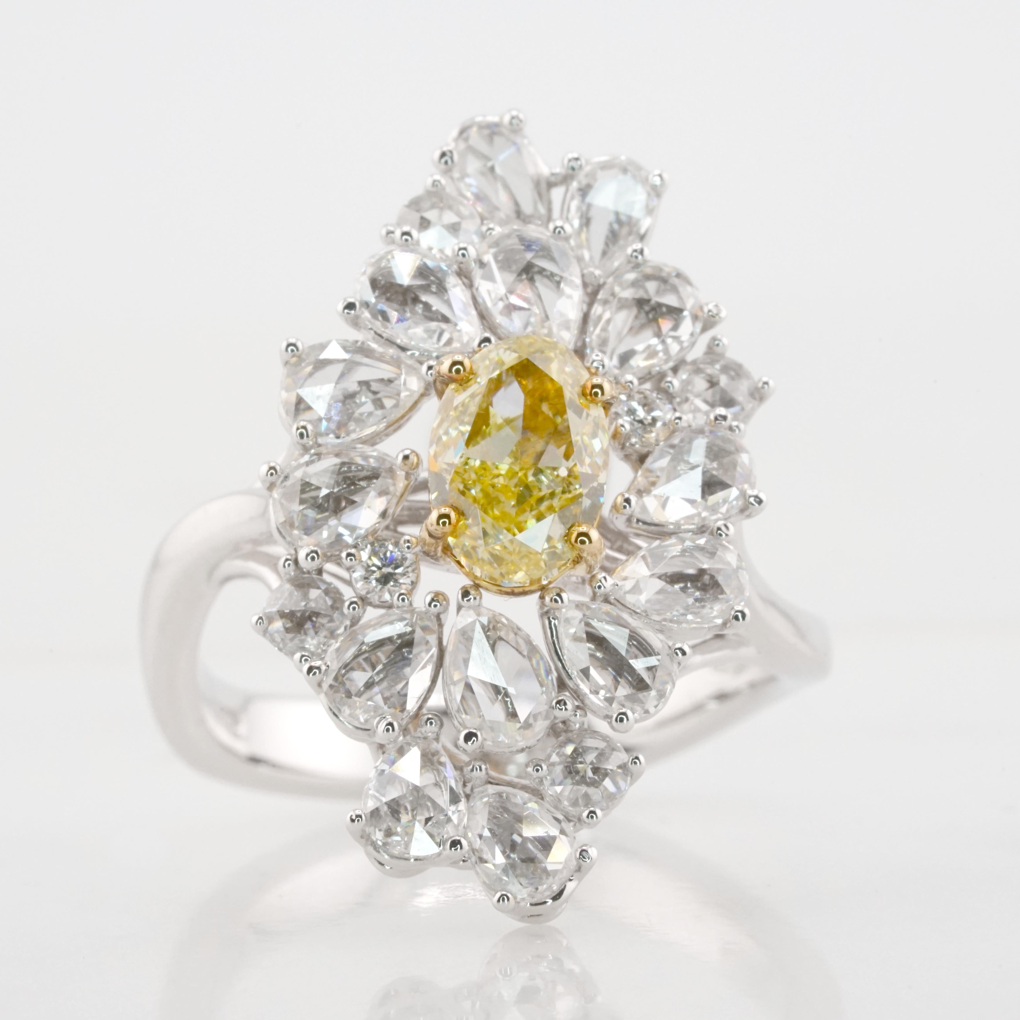 This amazing Antinori Di Sanpietro original creation features a 1.13 carat oval natural fancy yellow diamond.
The main stone is certified by GIA, the most important gemological laboratory for diamonds, being a fancy yellow is full of color and has