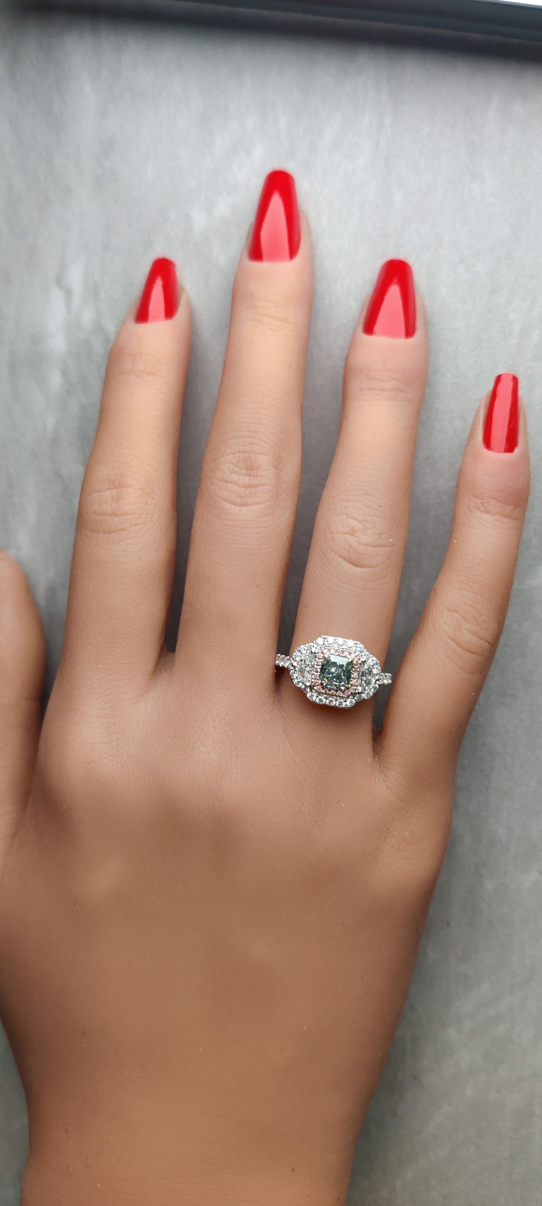RareGemWorld's classic GIA certified diamond ring. Mounted in a beautiful 18K Rose and White Gold setting with a natural asscher cut green diamond. The green diamond is surrounded by natural epaulette cut white diamonds, round natural white diamond