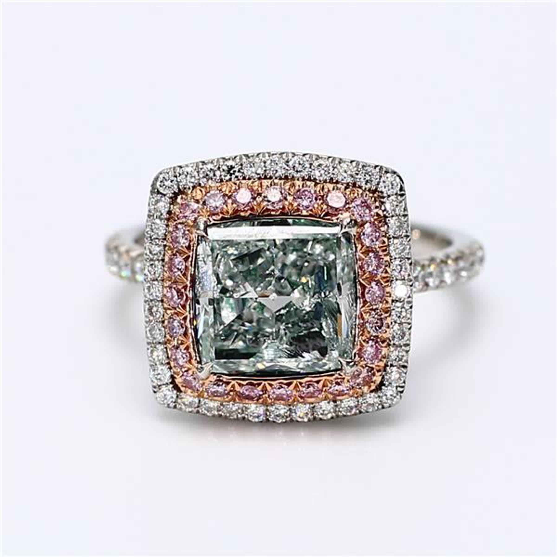RareGemWorld's classic GIA certified diamond ring. Mounted in a beautiful 18K Rose and White Gold setting with a natural cushion cut green diamond. The green diamond is surrounded by round natural pink diamond melee and round natural white diamond