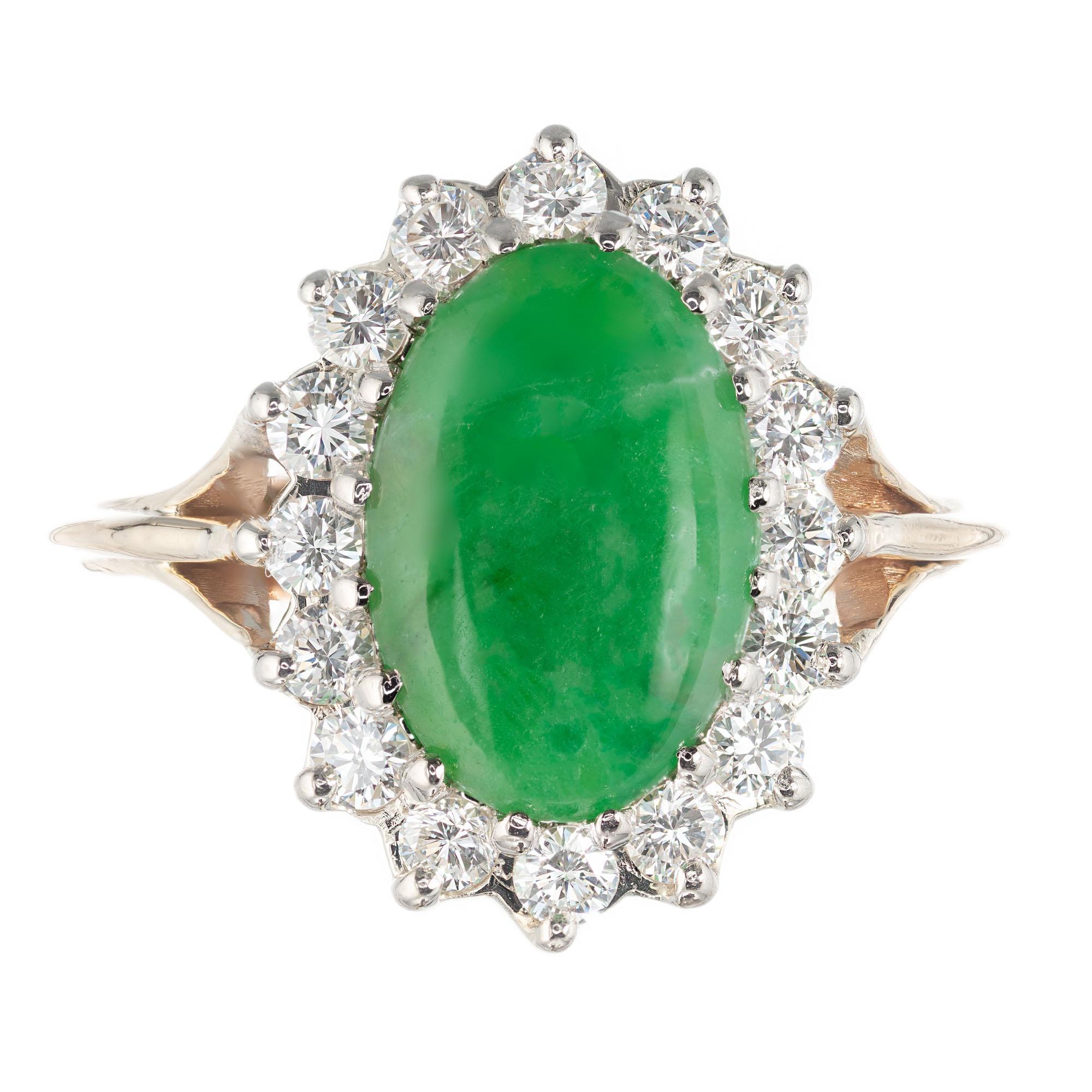 GIA certified A grade natural untreated Jadeite Jade ring with a halo of 16 round cut diamonds in a 14k yellow gold handmade setting.

1 11.60 x 8.60 x 2.05mm translucent Jadeite Jade natural green color no enhancements. GIA certificate #