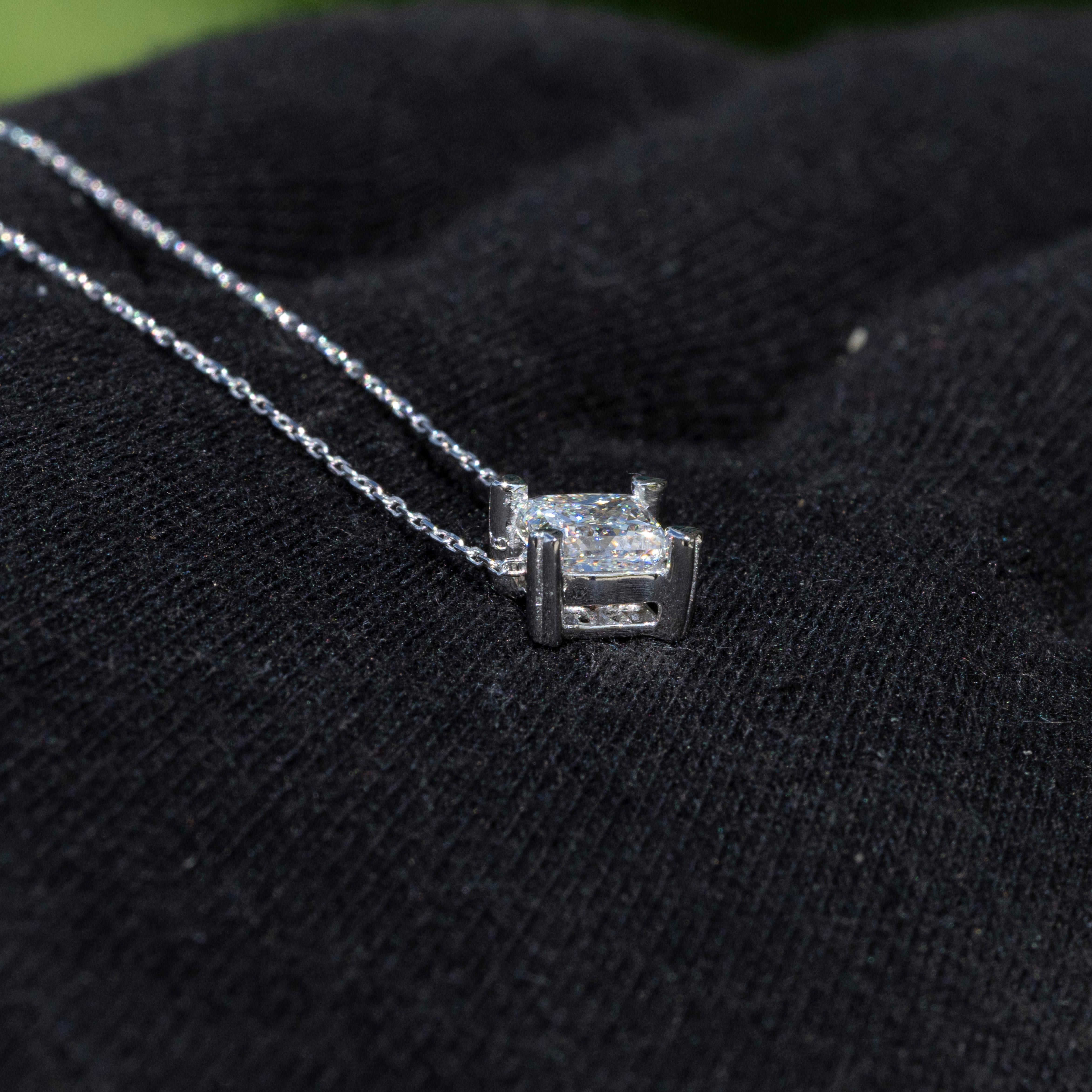 This elegant necklace features a 1.13-carat natural princess cut diamond set in 18K white gold. The diamond is GIA certified with top grades in color (D), clarity (Internally Flawless), polish, and symmetry, ensuring outstanding brilliance and
