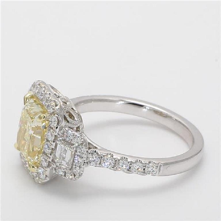 Raregemworld's stunning GIA Certified Natural Light Yellow (YZ) Radiant Cut 2.08 carats Diamond Ring with 2 small Emerald Cut White diamond .033 carats.  Surrounded by 42 small round white diamonds 0.71cts.  All beautifully mounted in 18K White and
