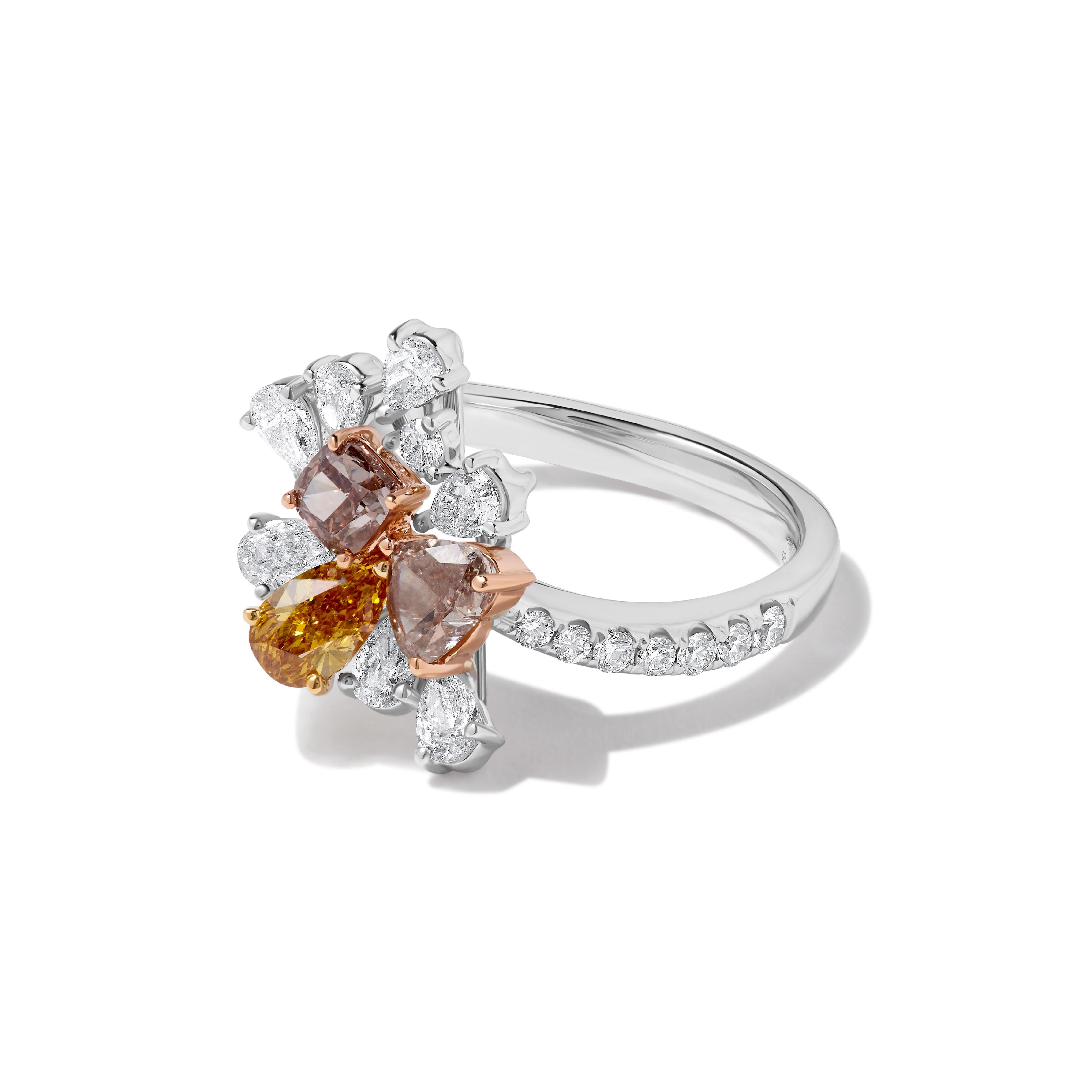 RareGemWorld's beautiful GIA certified diamond ring. Mounted in a beautiful 18K Rose and White Gold setting with a natural cushion cut pink diamond, a natural heart cut pink diamond, and a natural pear cut yellow diamond. These diamonds are