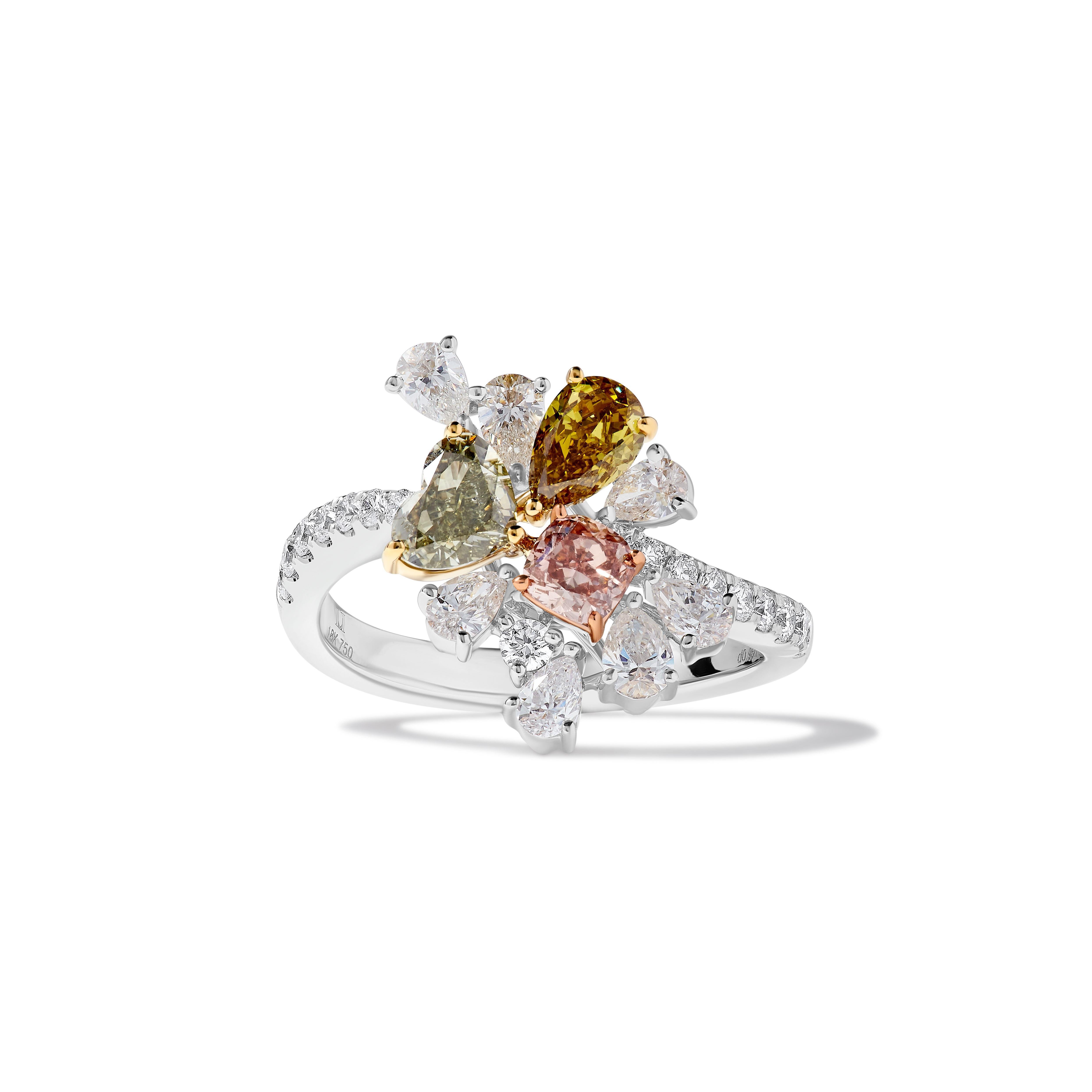 RareGemWorld's intriguing GIA certified diamond ring. Mounted in a beautiful 18K Rose and White Gold setting with a natural cushion cut pink diamond, a natural heart cut green diamond, and a natural pear cut yellow diamond. These diamonds are