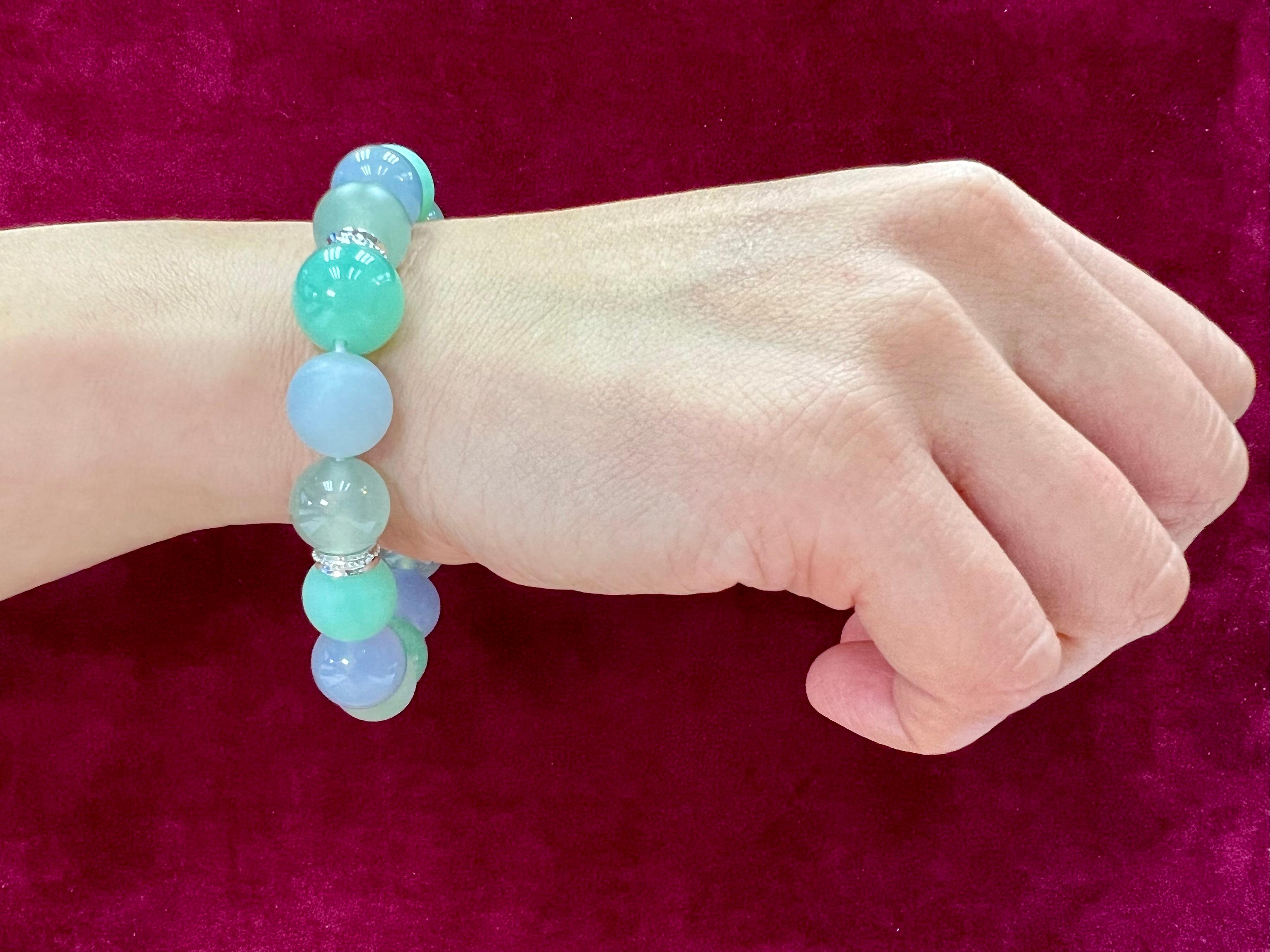 Please check out the HD video! This is certified by 3 labs to be natural jadeite jade. The color of the jades has a nice color shift under different lighting. This bracelet is made up of 15 natural jade beads. 8 beads are fully polished and 7 beads