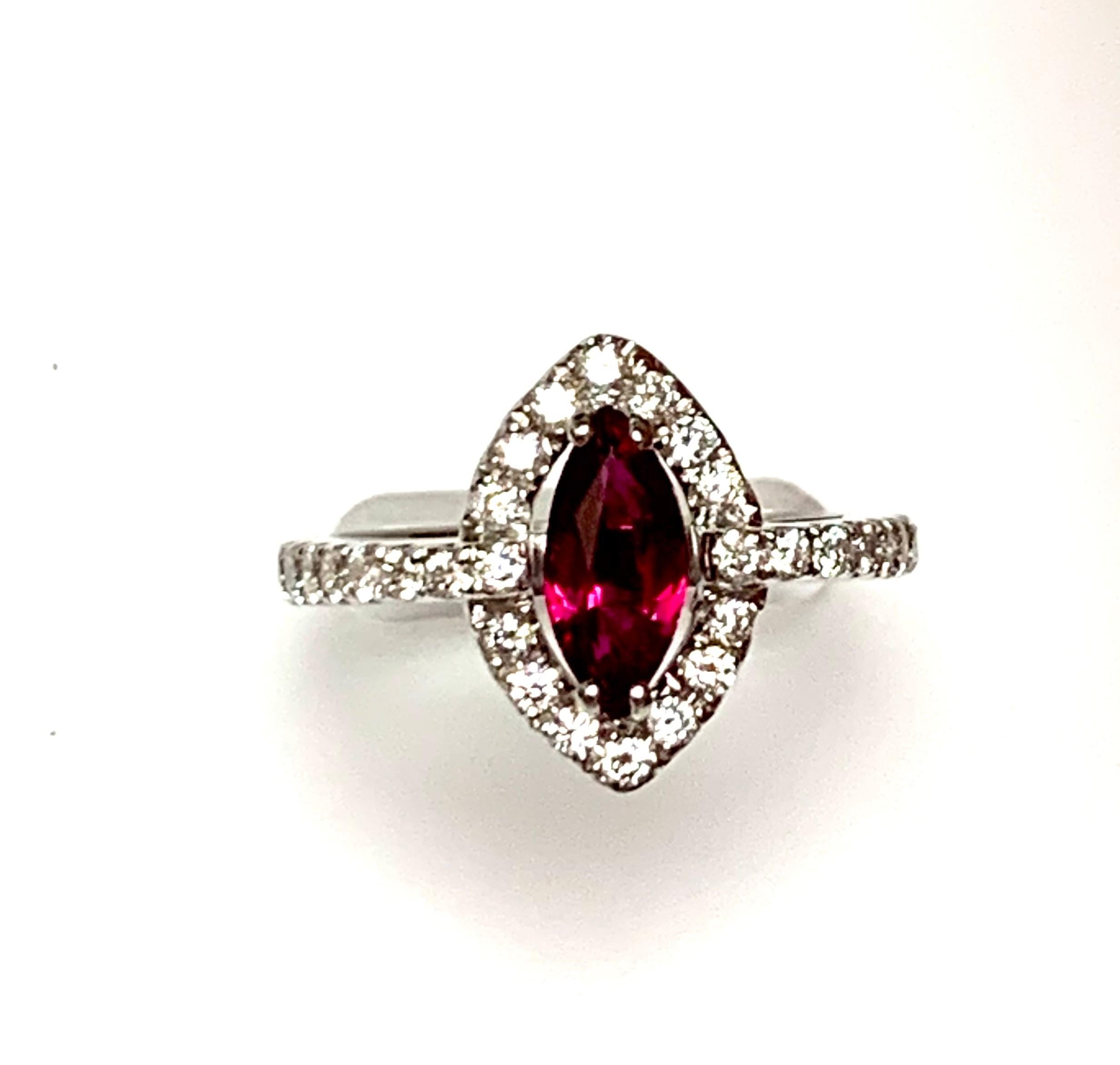 1.01 Carat Marquise shape Natural no heat ruby set in 18k white gold rinf surronded with 0.55 ct diamonds around and half way on the shank.
