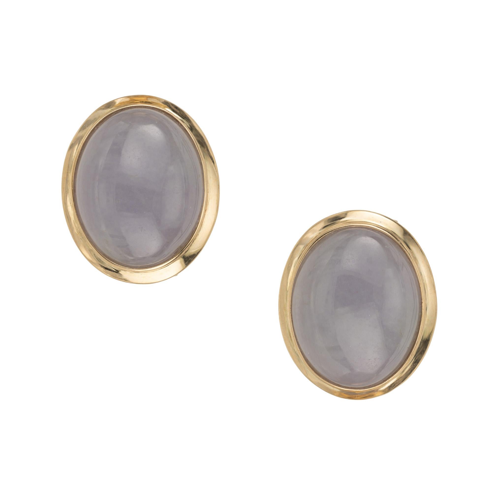 Revel in the allure of luxury with our GIA certified natural oval purple gray  Jadeite Jade gold clip post earrings. These exquisite earrings are adorned with lustrous purple cabochon oval jadeite which are meticulously crafted and set in 14k yellow