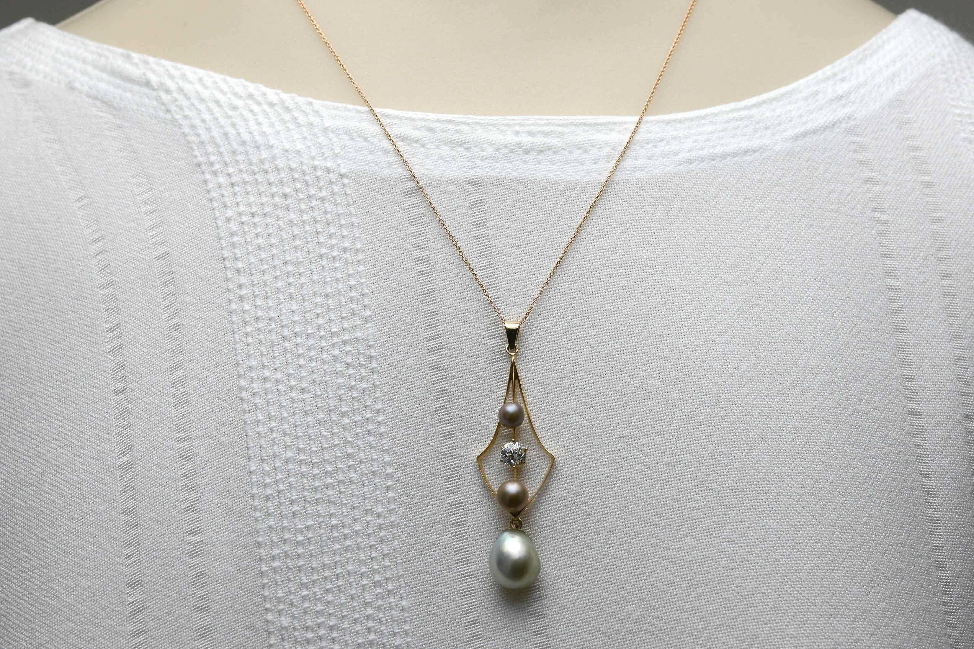 The Capitola Antique Necklace. A most curvaceous and lithe antique pendant that you love wearing everywhere. Centering on a lustrous teardrop silvery pearl, a shimmering old European cut diamond over 1/2 carat, held within a soft rose gold shield