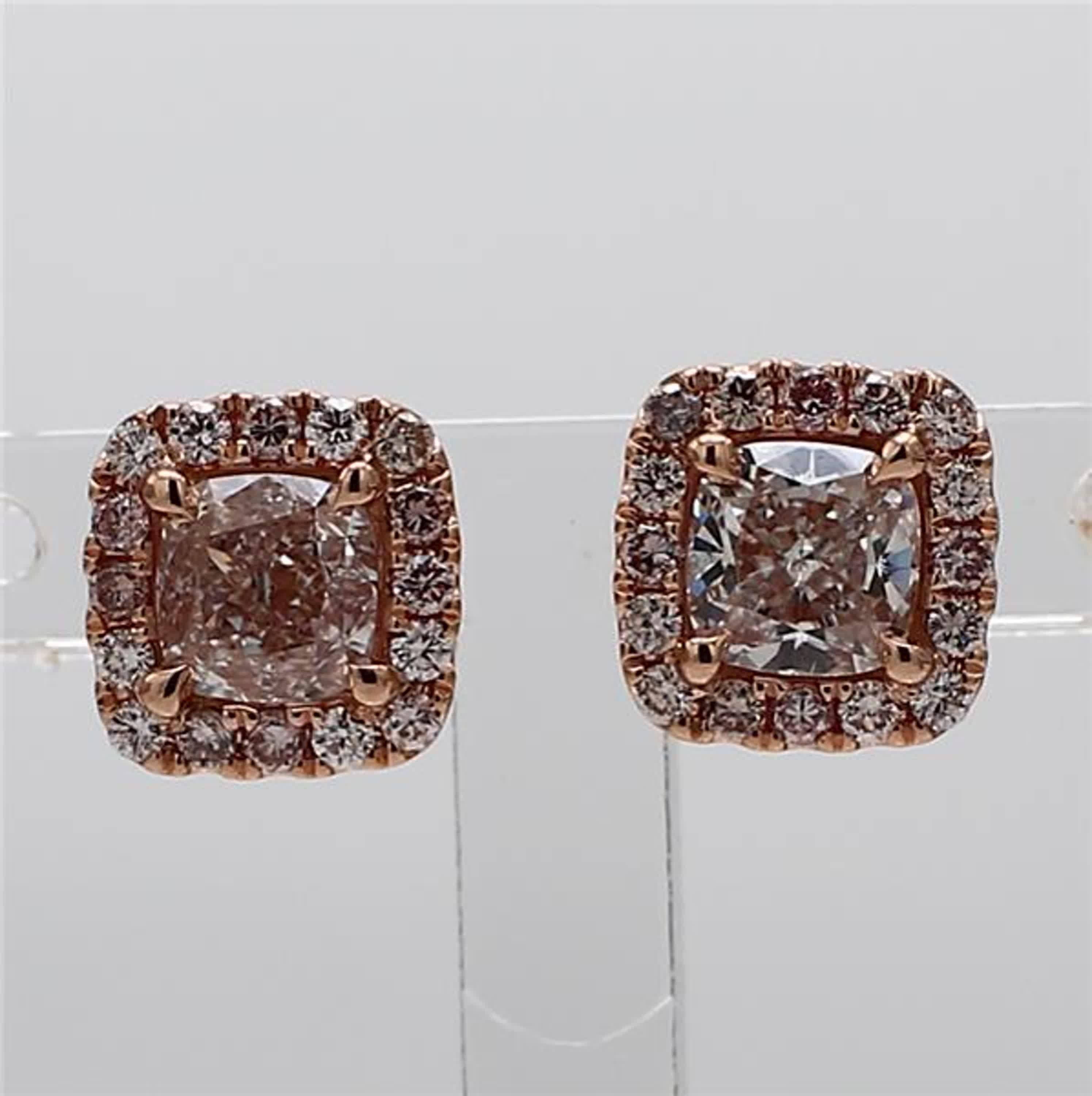 RareGemWorld's classic GIA certified diamond earrings. Mounted in a beautiful 18K Rose Gold setting with natural cushion cut pink diamonds. The pink diamonds are surrounded by round natural pink diamond melee. These earrings are guaranteed to
